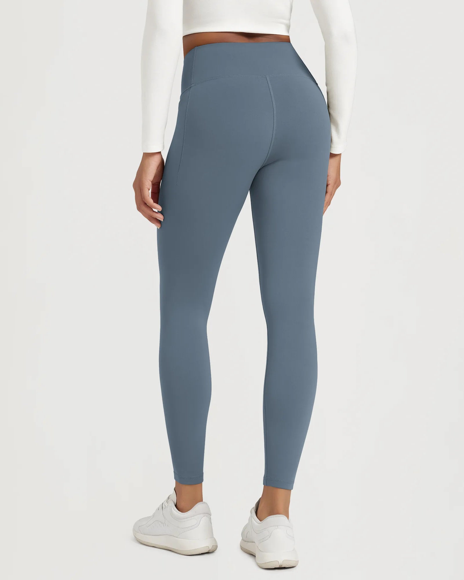 25" Fleece Lined Leggings with Pockets seen from the back, showcasing the flattering fit and design.