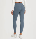 25" Fleece Lined Leggings with Pockets seen from the back, showcasing the flattering fit and design.