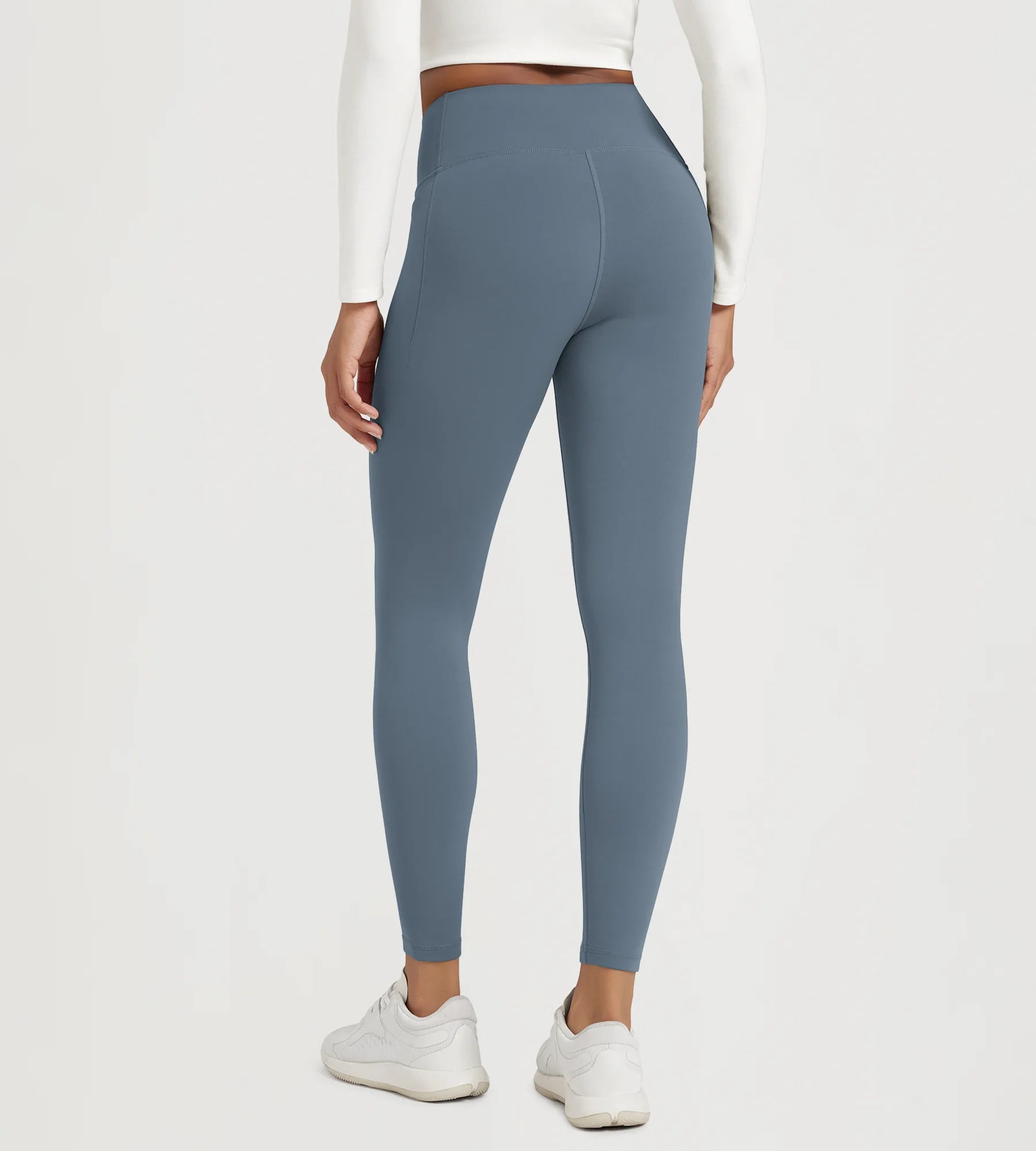 25" Fleece Lined Leggings with Pockets seen from the back, showcasing the flattering fit and design.