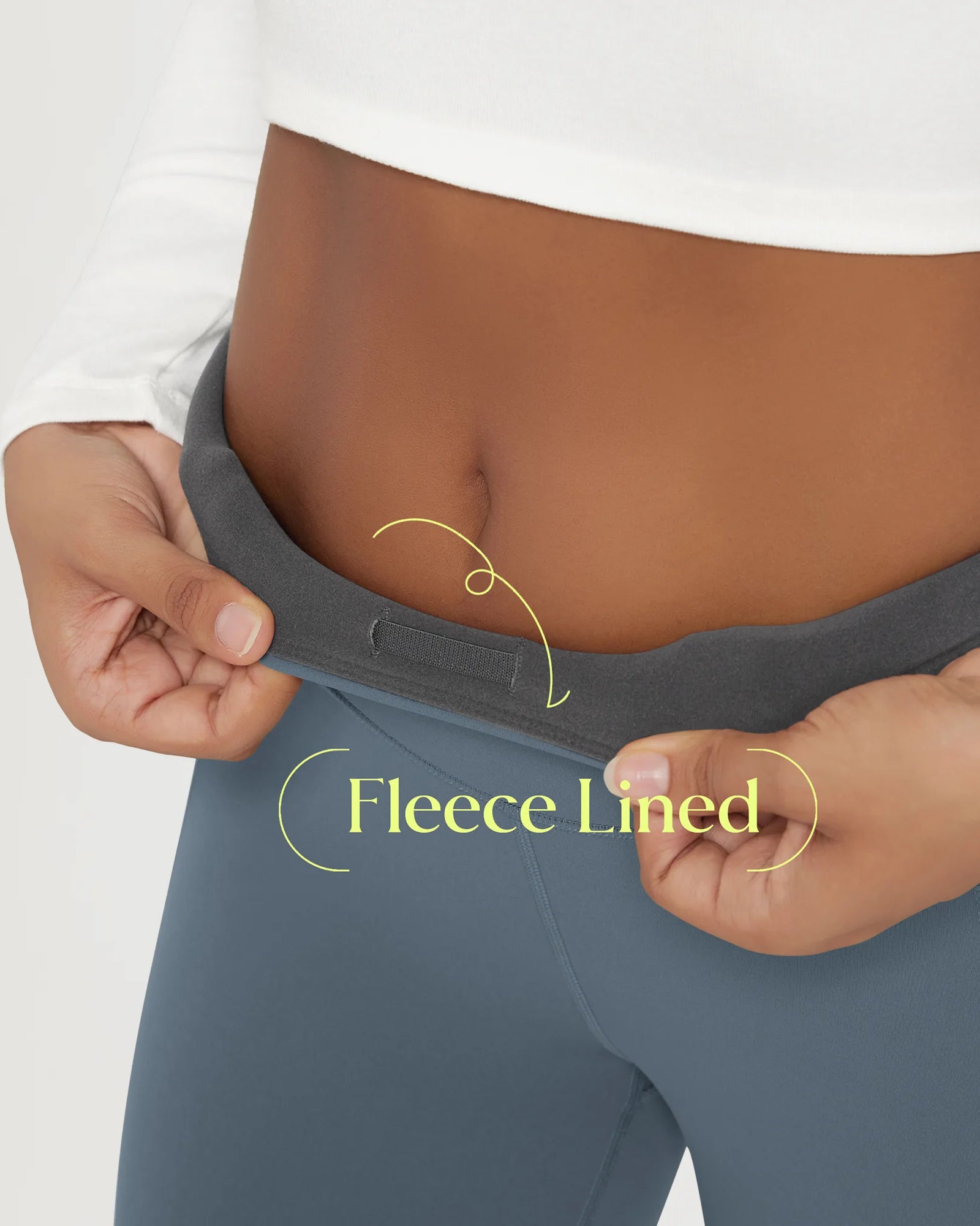 Model showcasing the waistband of 25" Fleece Lined Leggings with Pockets, highlighting the fleece lining detail.