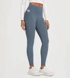 Comfortable 25" Fleece Lined Leggings with Pockets in blue, perfect for workouts and casual wear.