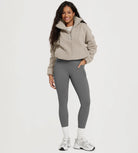 Model showcasing 25" Fleece Lined Leggings with Pockets, paired with a cozy pullover and sneakers.
