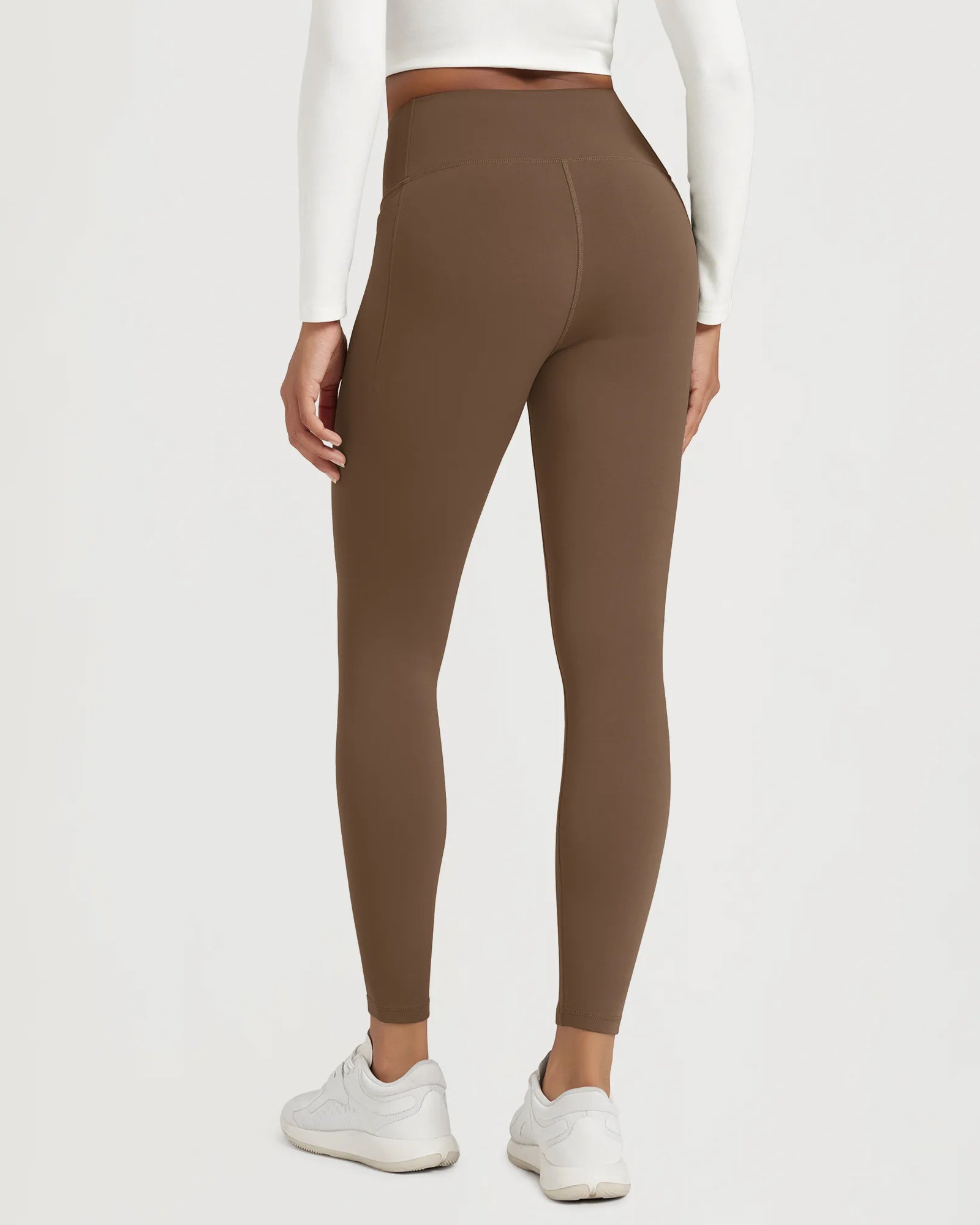 25" Fleece Lined Leggings with Pockets in brown color, featuring a high-waisted design and a comfortable fit.