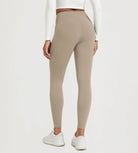 25" Fleece Lined Leggings with Pockets worn by a model from the back, showcasing a comfortable fit and style.