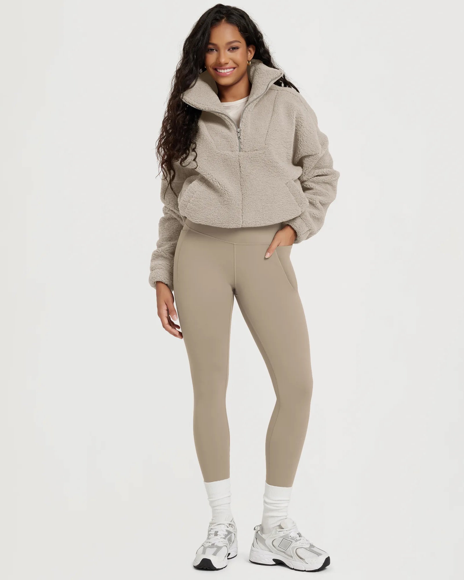 25" Fleece Lined Leggings with Pockets paired with a cozy fleece jacket and stylish footwear.
