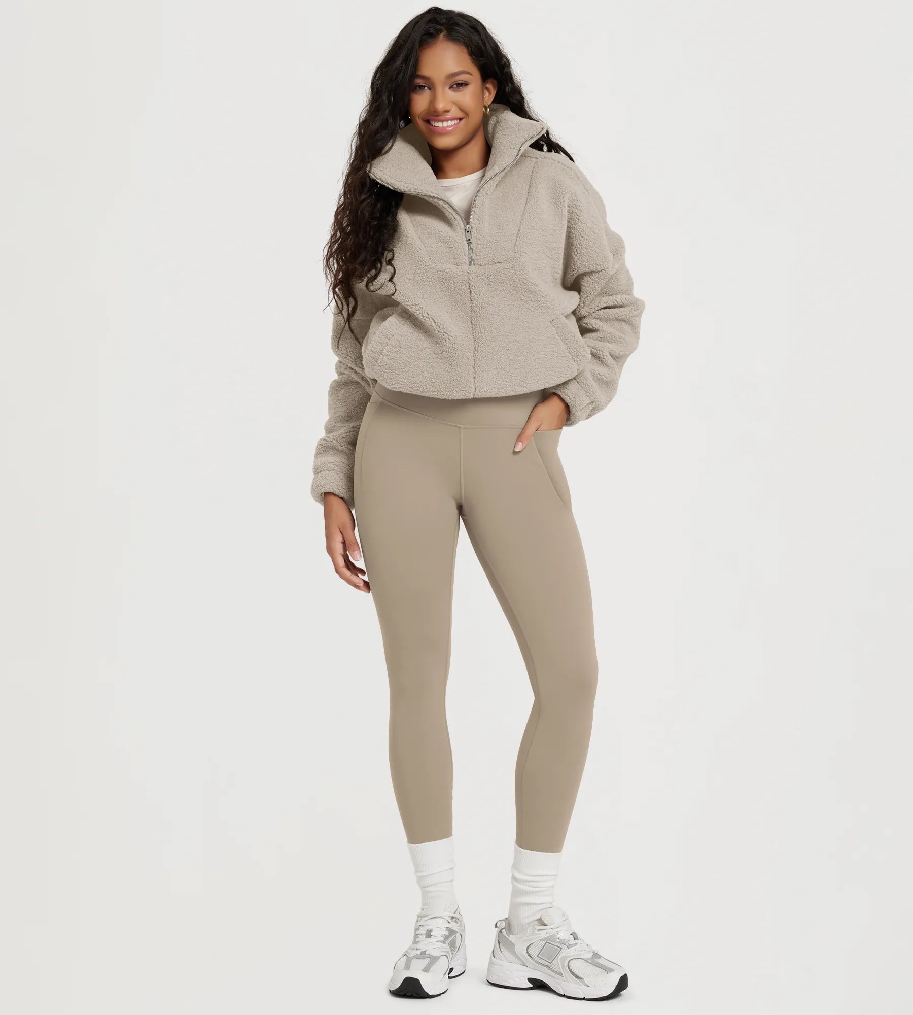 25" Fleece Lined Leggings with Pockets paired with a cozy fleece jacket and stylish footwear.