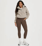25" Fleece Lined Leggings with Pockets worn by a woman in a cozy outfit.