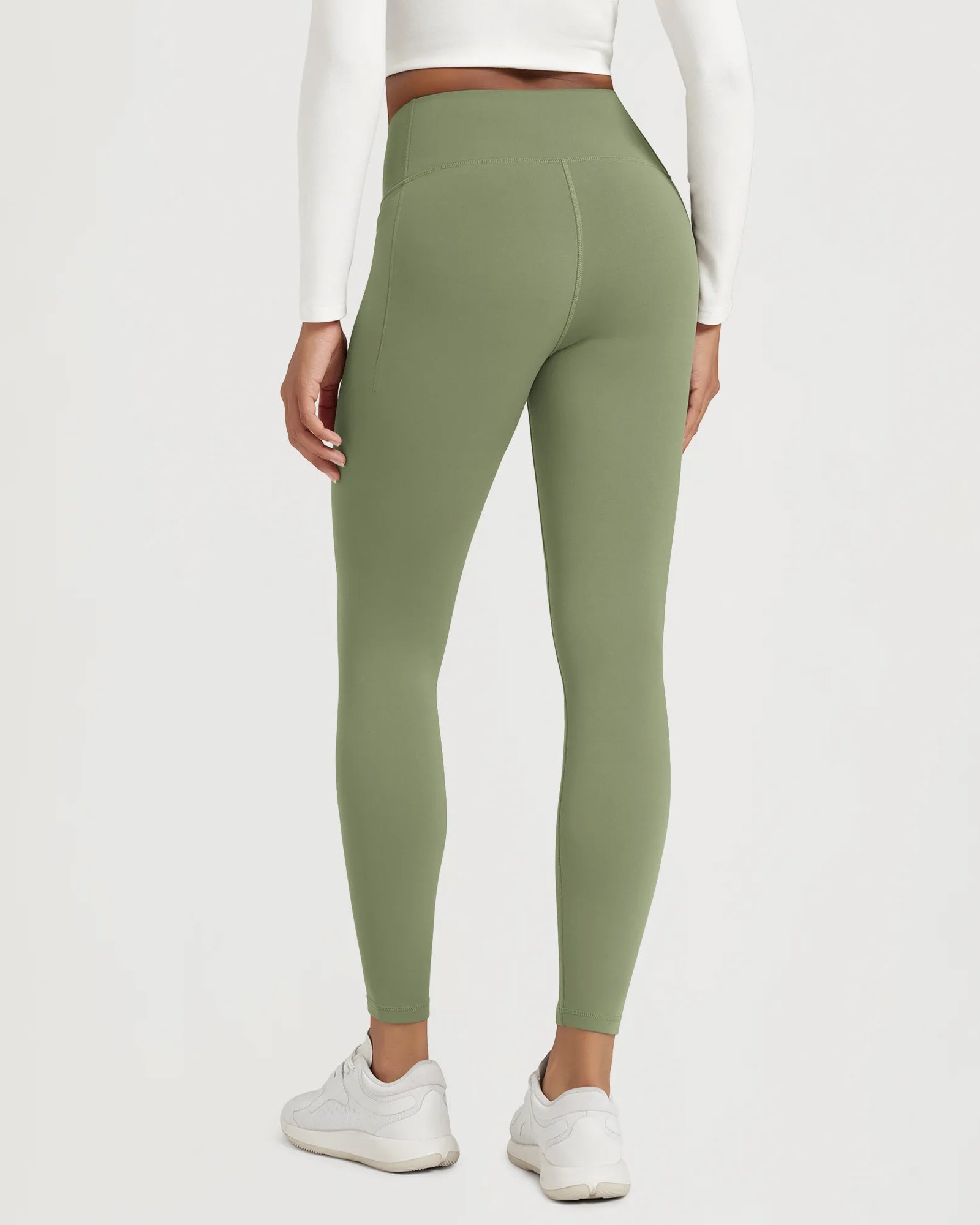 25" Fleece Lined Leggings with Pockets in green, showcasing the back view and high waist design.