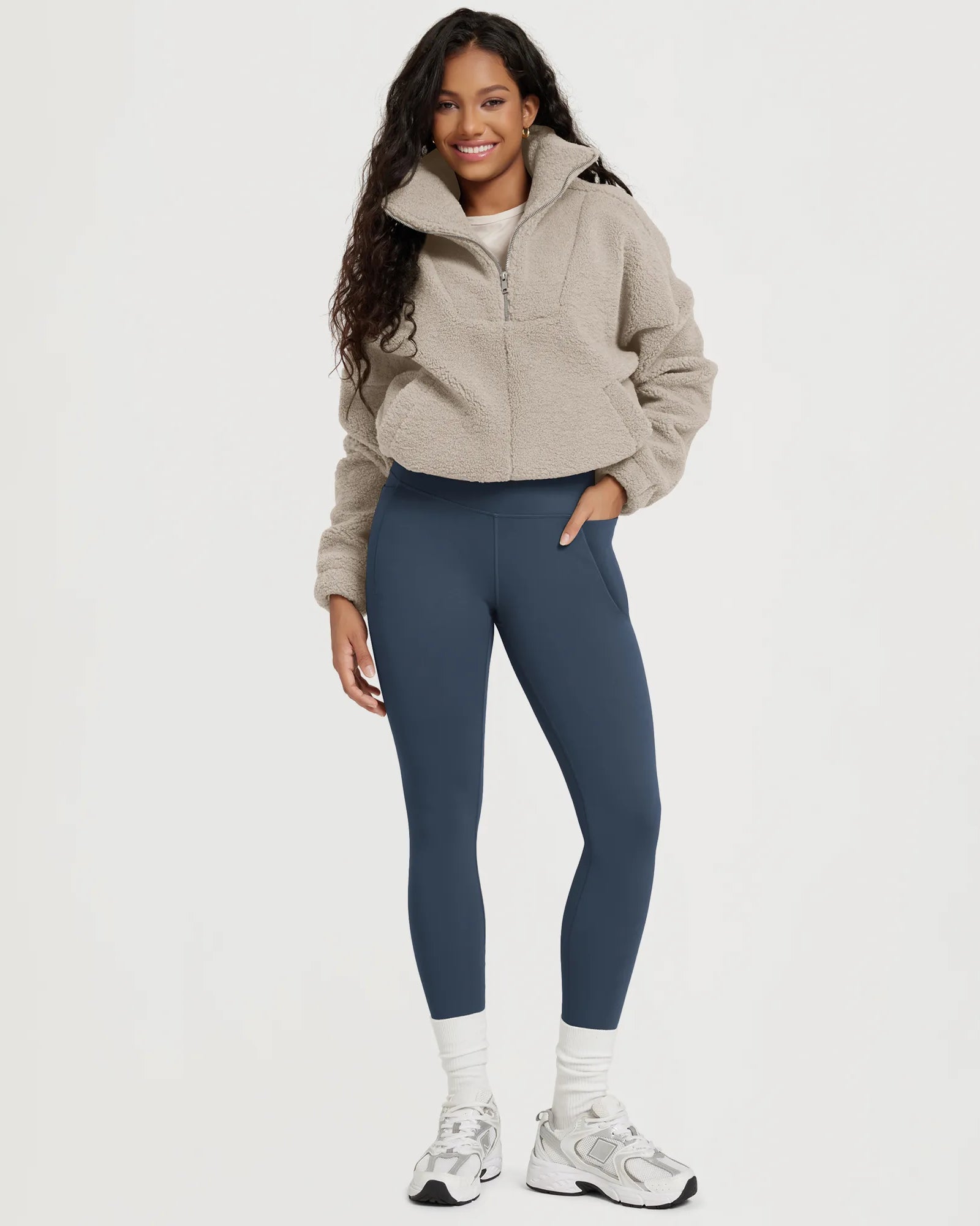 25" Fleece Lined Leggings with Pockets worn by a model, featuring a stylish and comfortable look.