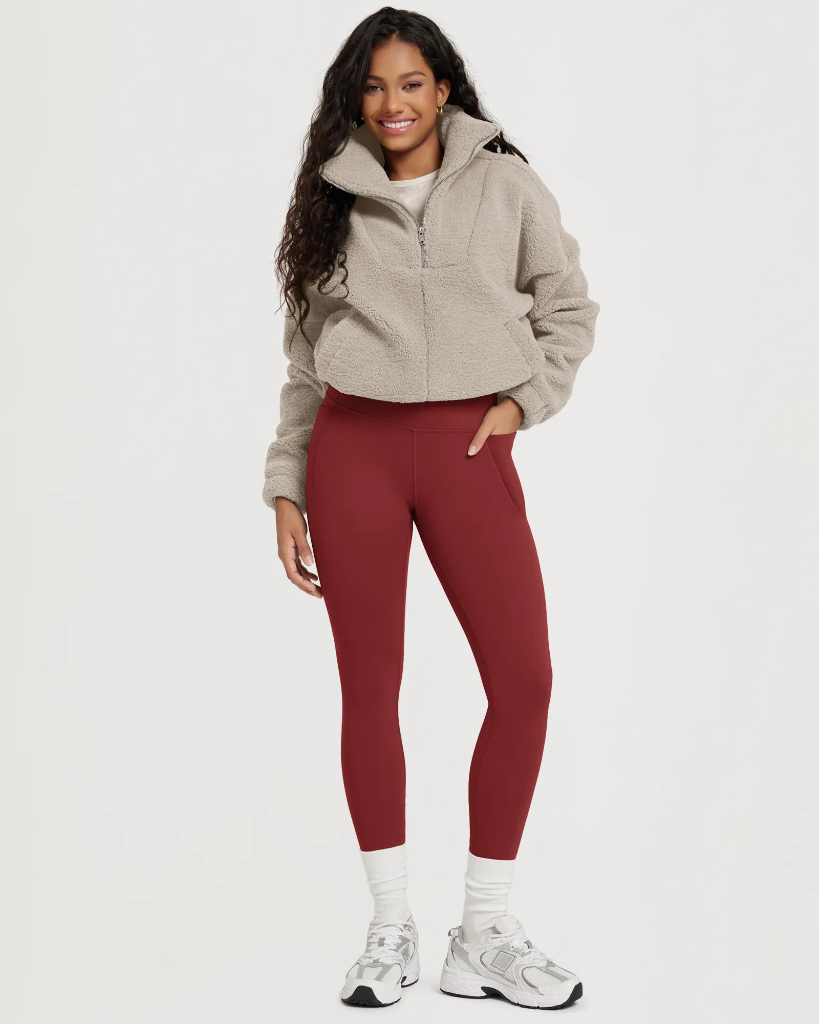 25" Fleece Lined Leggings with Pockets worn by a model, paired with a cozy jacket and sneakers.