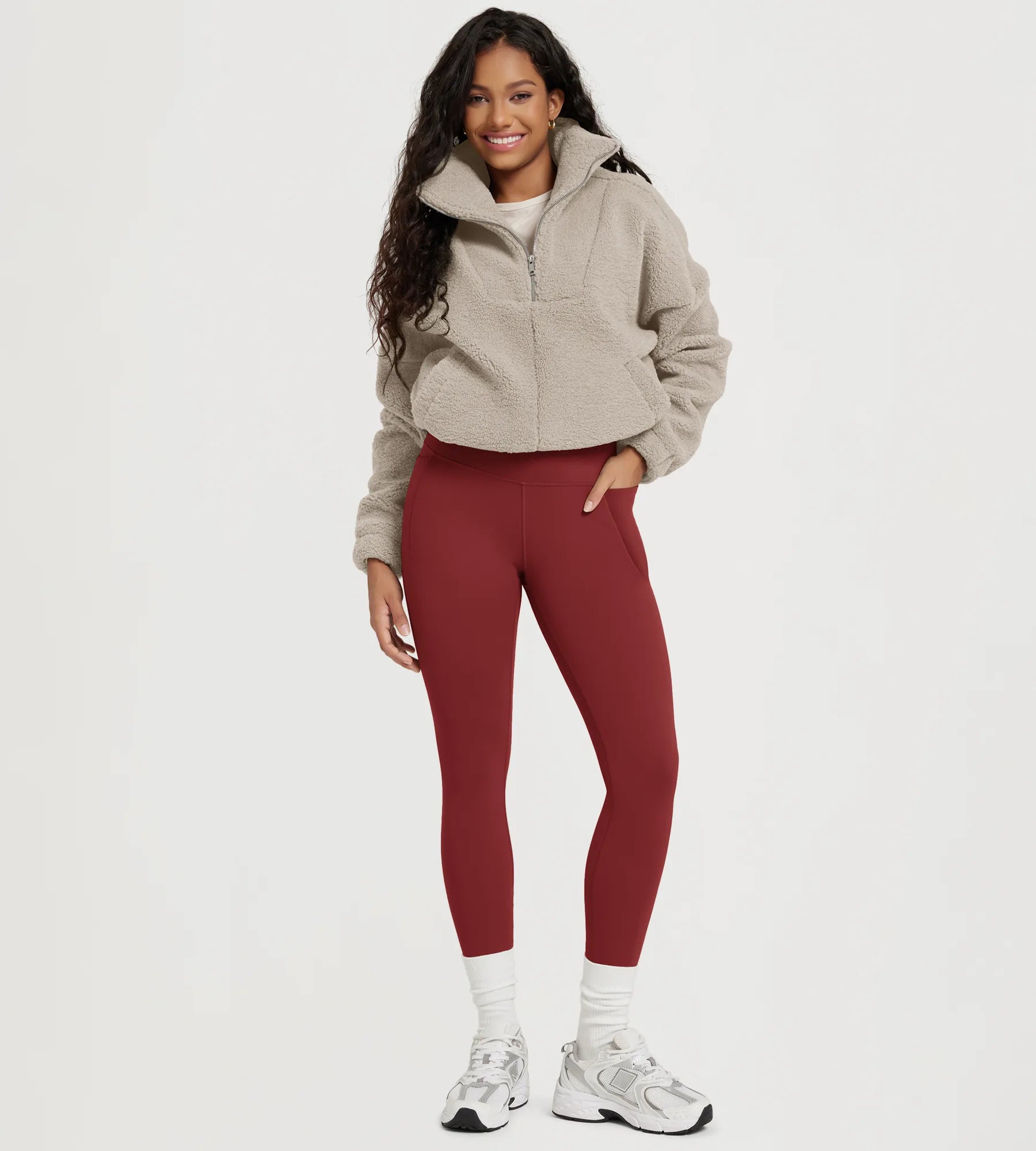 25" Fleece Lined Leggings with Pockets worn by a model, paired with a cozy jacket and sneakers.