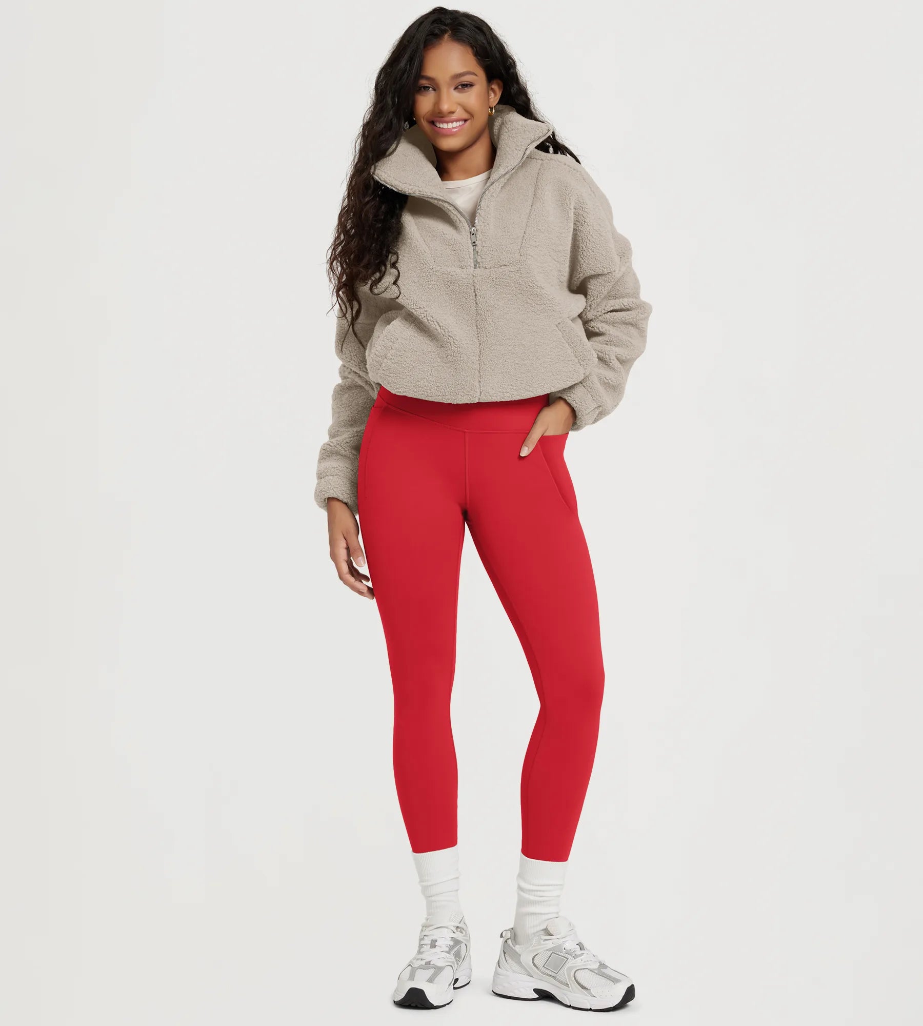 25" Fleece Lined Leggings with Pockets in red, paired with a cozy beige fleece jacket.