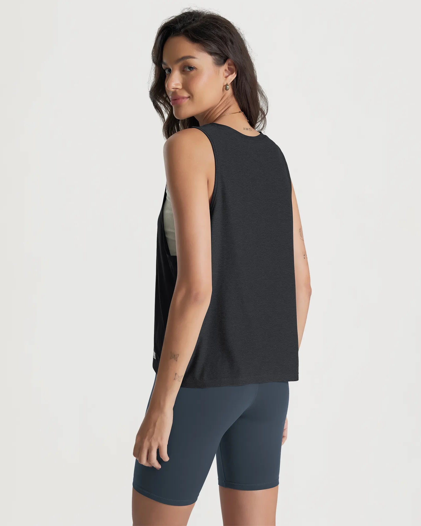 ODODOS Stratum loose tank tops showcasing soft fabric and athletic fit for workout wear.