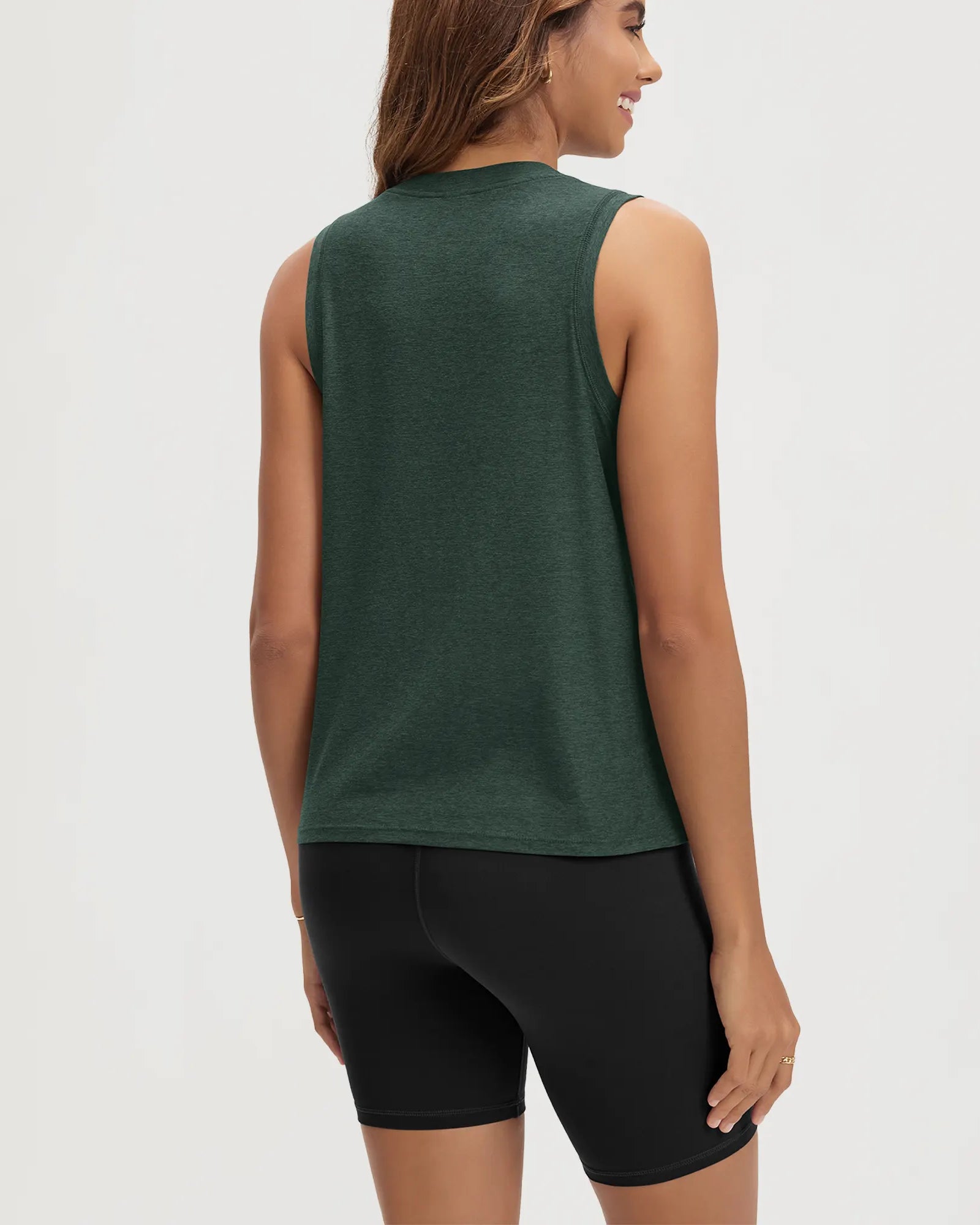 ODODOS Stratum Women's Performance Tank in dark green, athletic fit with breathable soft fabric.