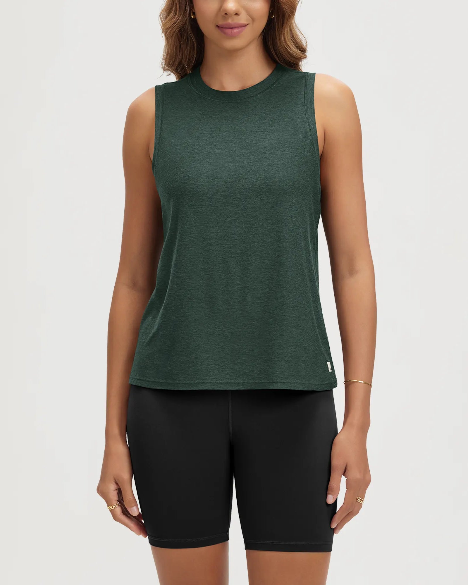 ODODOS Stratum Women's Performance Tank in green, soft fabric design for athletic wear.