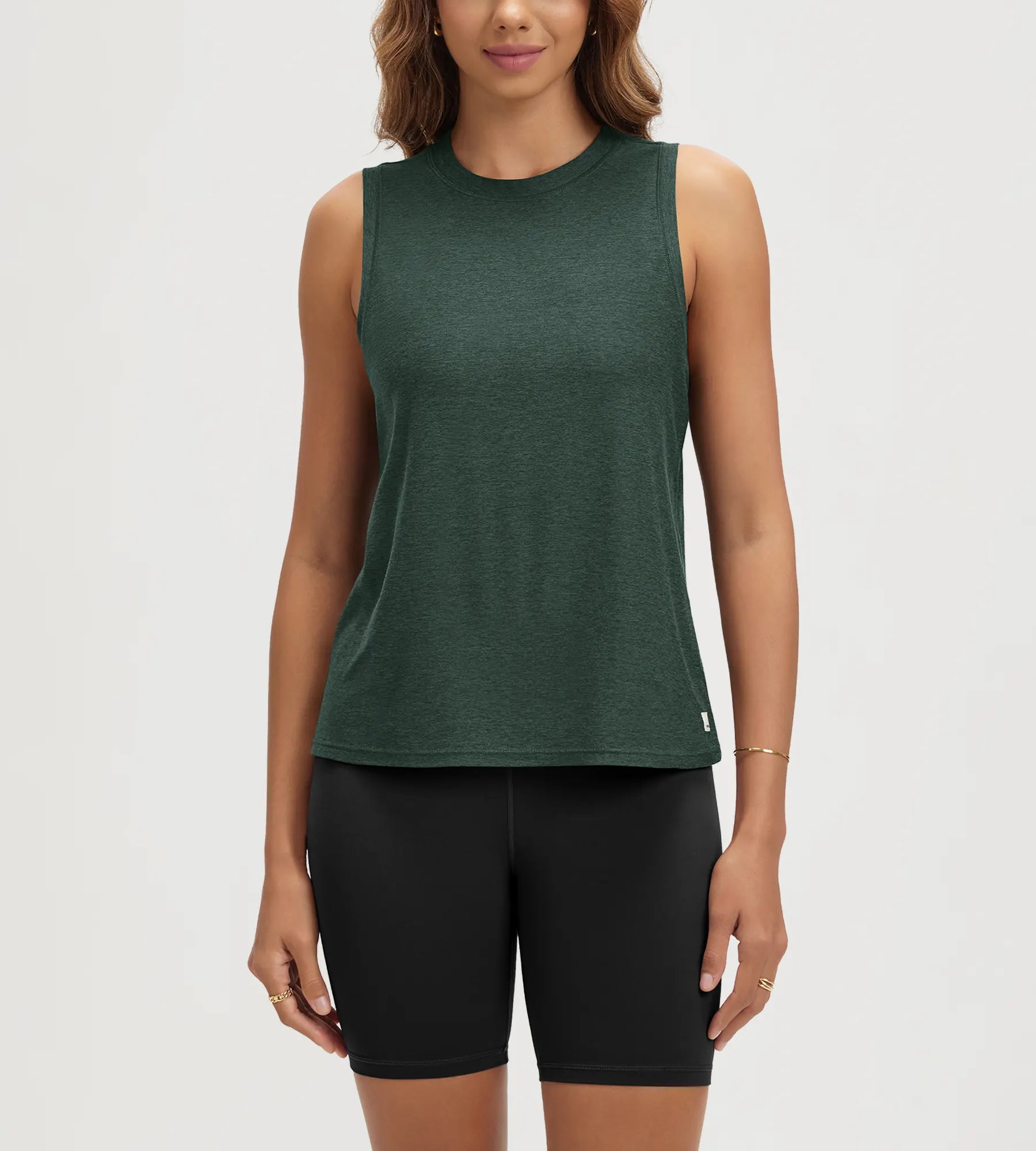 ODODOS Stratum Women's Performance Tank in green, soft fabric design for athletic wear.