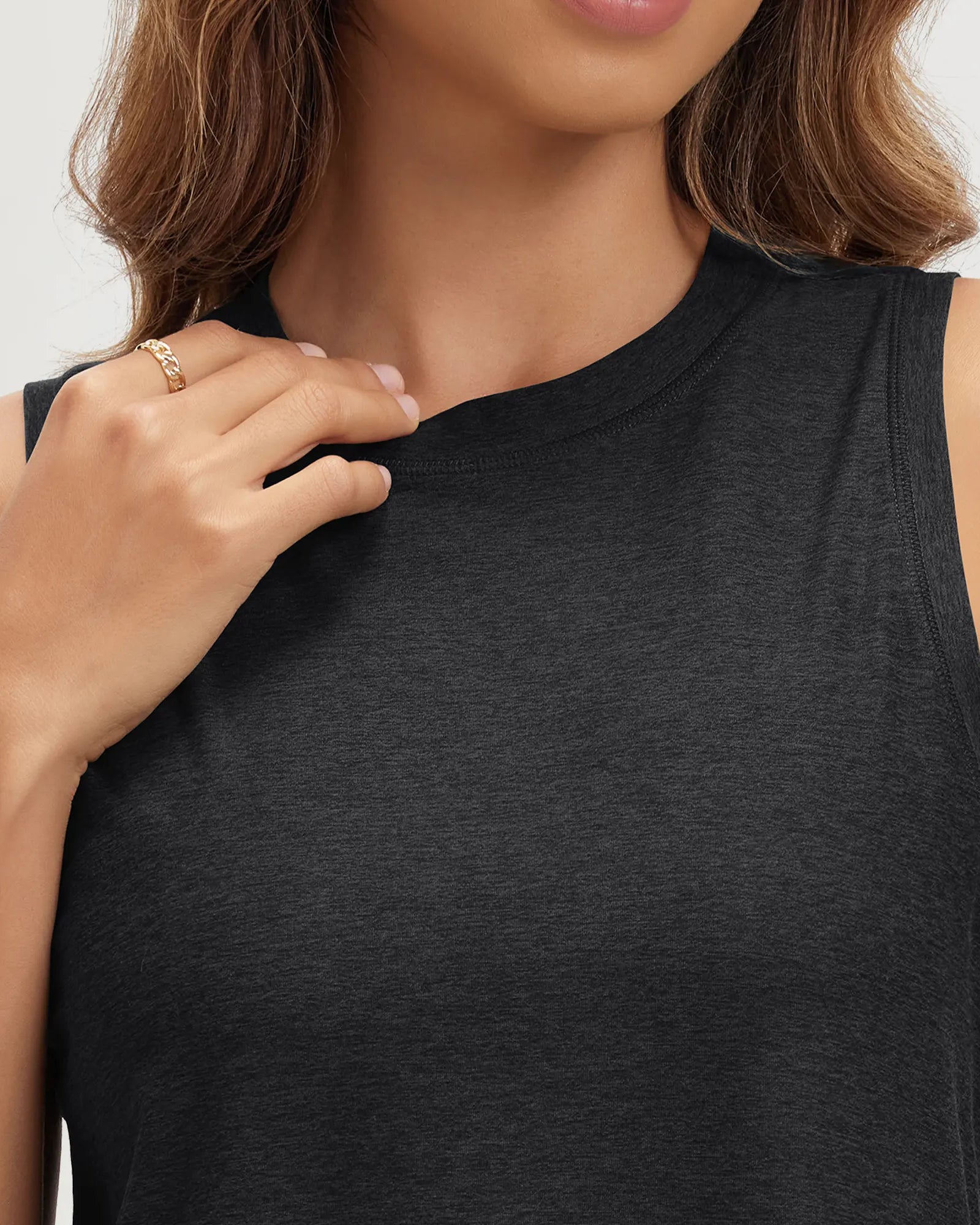 ODODOS Stratum performance tank in soft fabric with a relaxed fit and mock neck design.