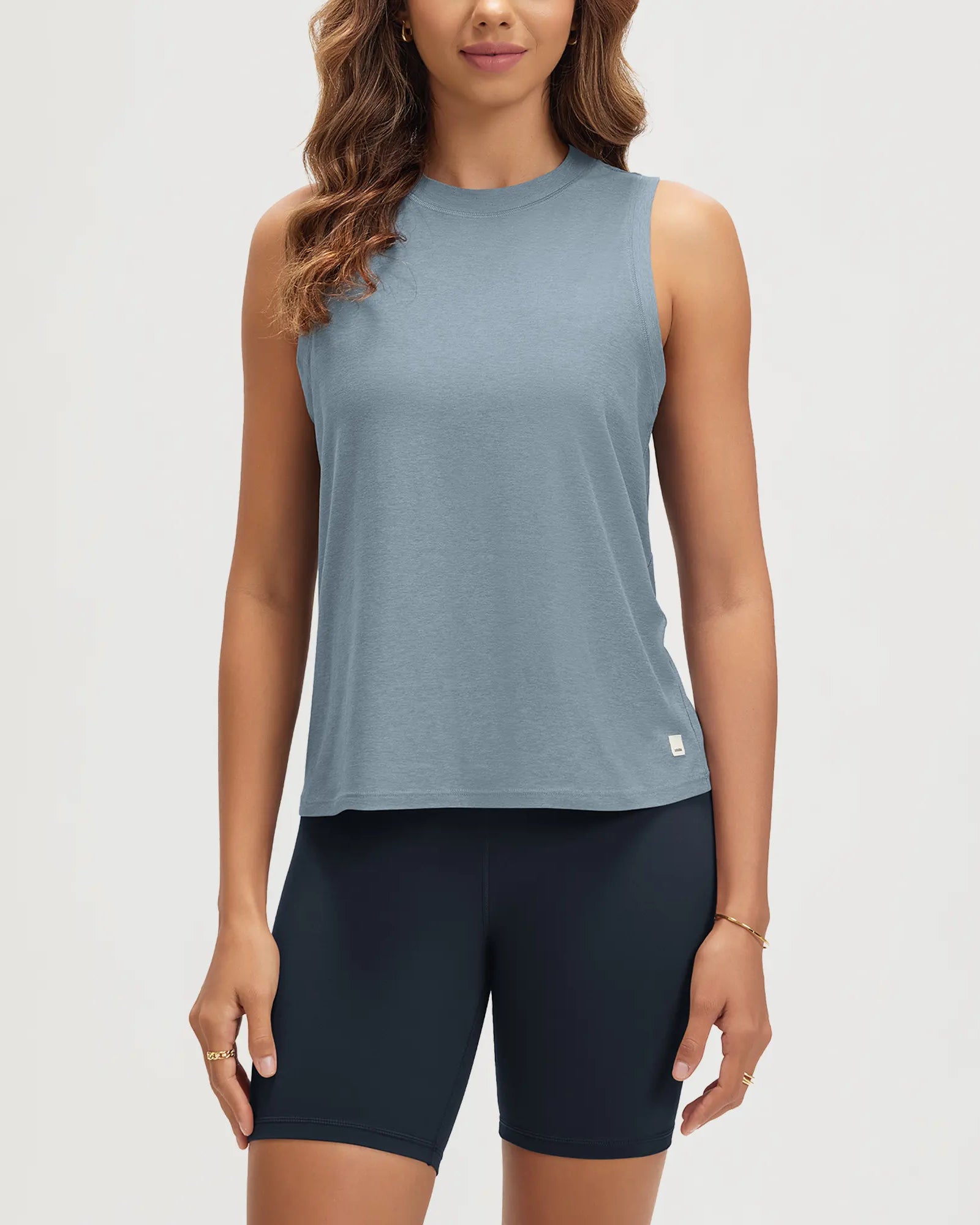 ODODOS Stratum Women's Performance Tank in soft fabric, breathable athletic fit, perfect for workout wear.
