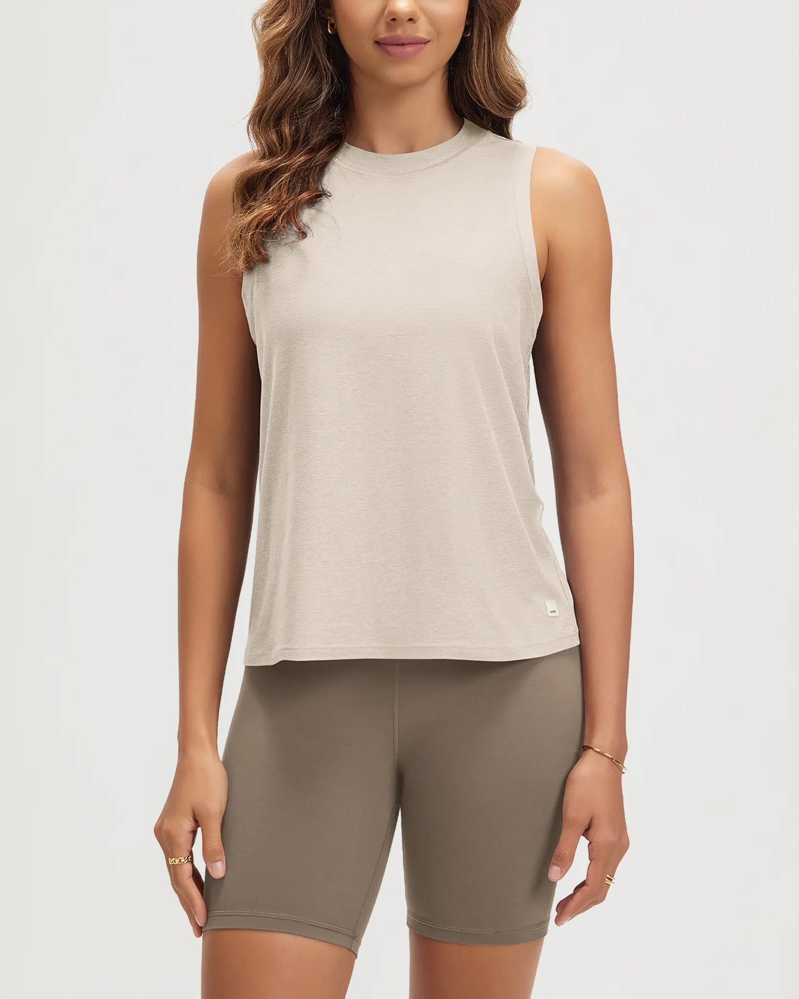 ODODOS Stratum performance tank with soft fabric and athletic fit in light beige.