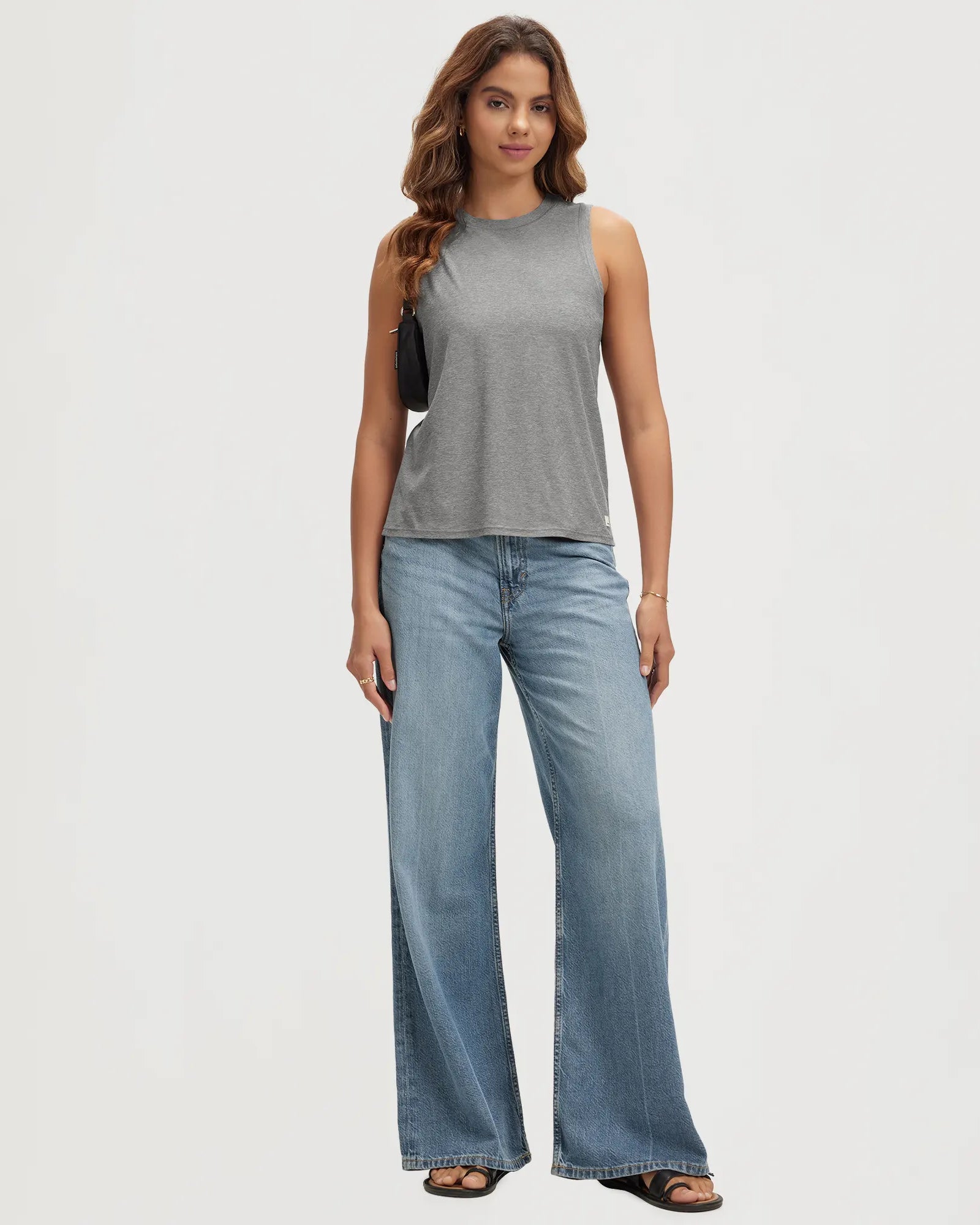 ODODOS Stratum Women's Performance Tank in soft fabric paired with wide-leg jeans.