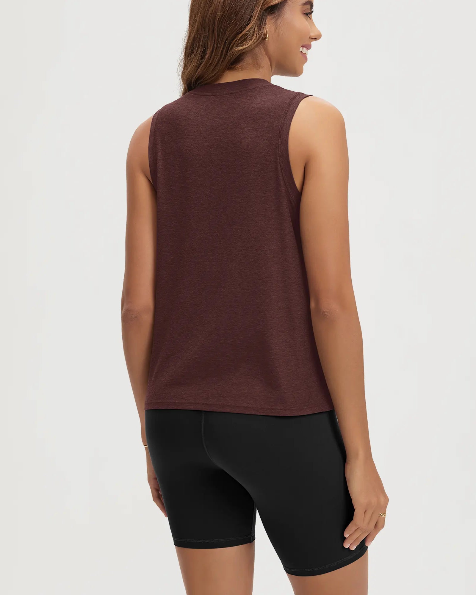 ODODOS Stratum Women's Performance Tank in maroon, showcasing breathable soft fabric and athletic fit.