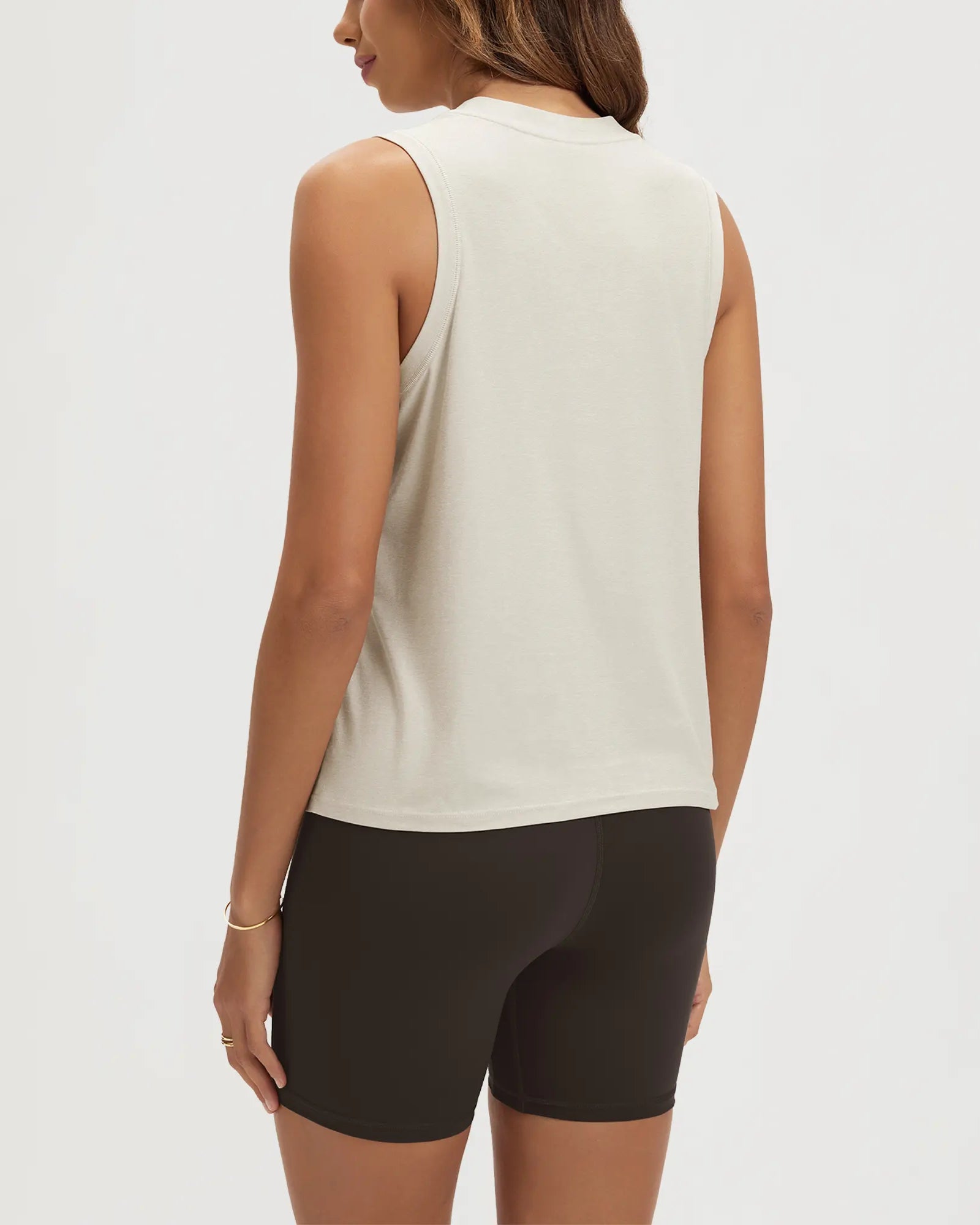 ODODOS Stratum women's performance tank with athletic fit and soft fabric, paired with shorts.