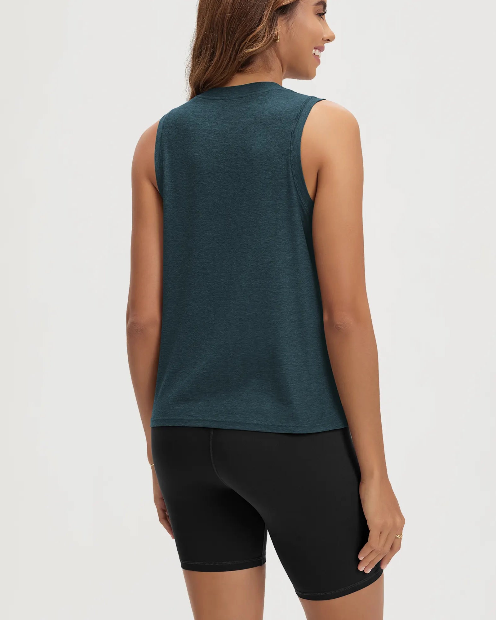 ODODOS Stratum women's performance tank in soft fabric, paired with black shorts.