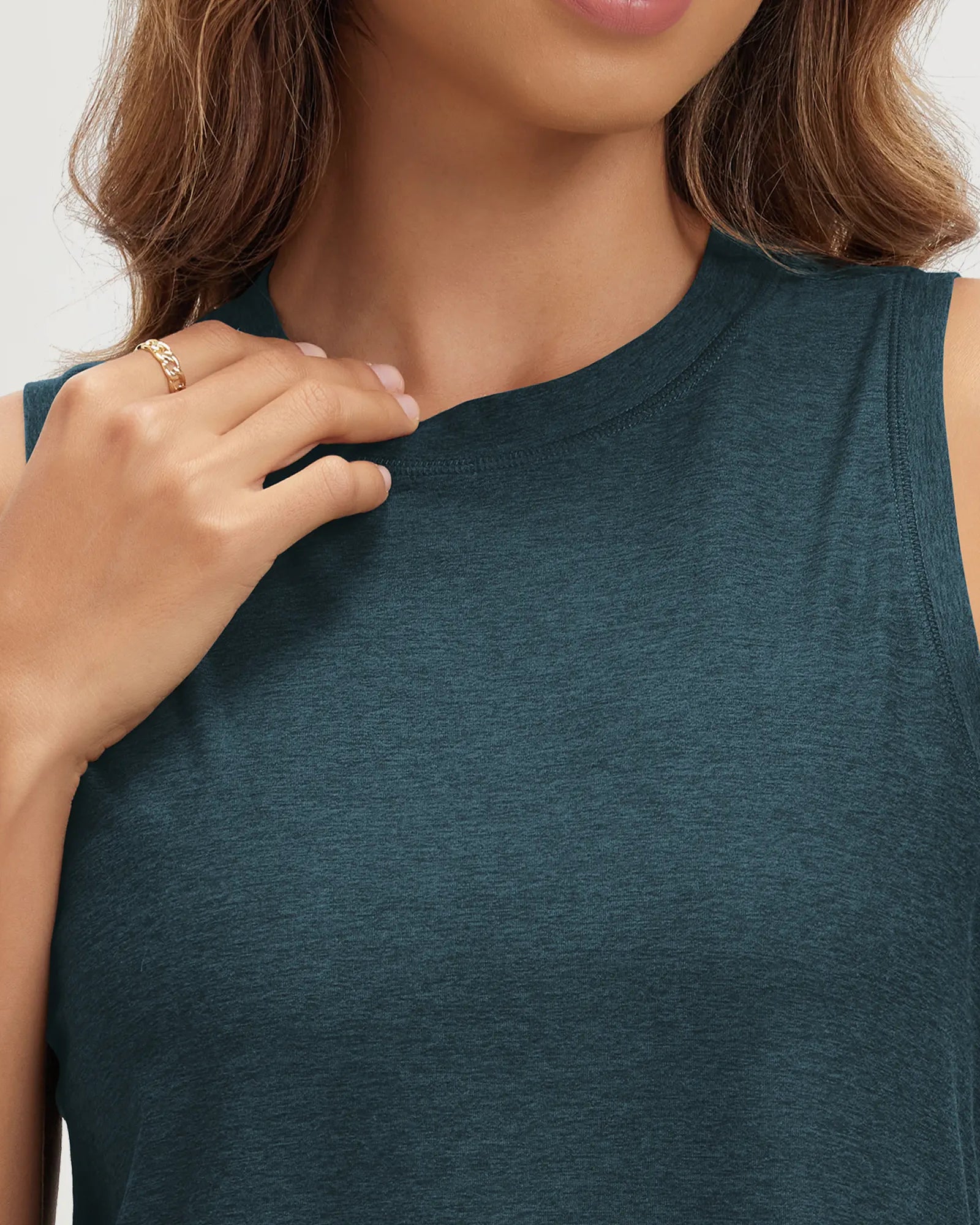ODODOS Stratum Women's Performance Tank in soft fabric with mock neck design.