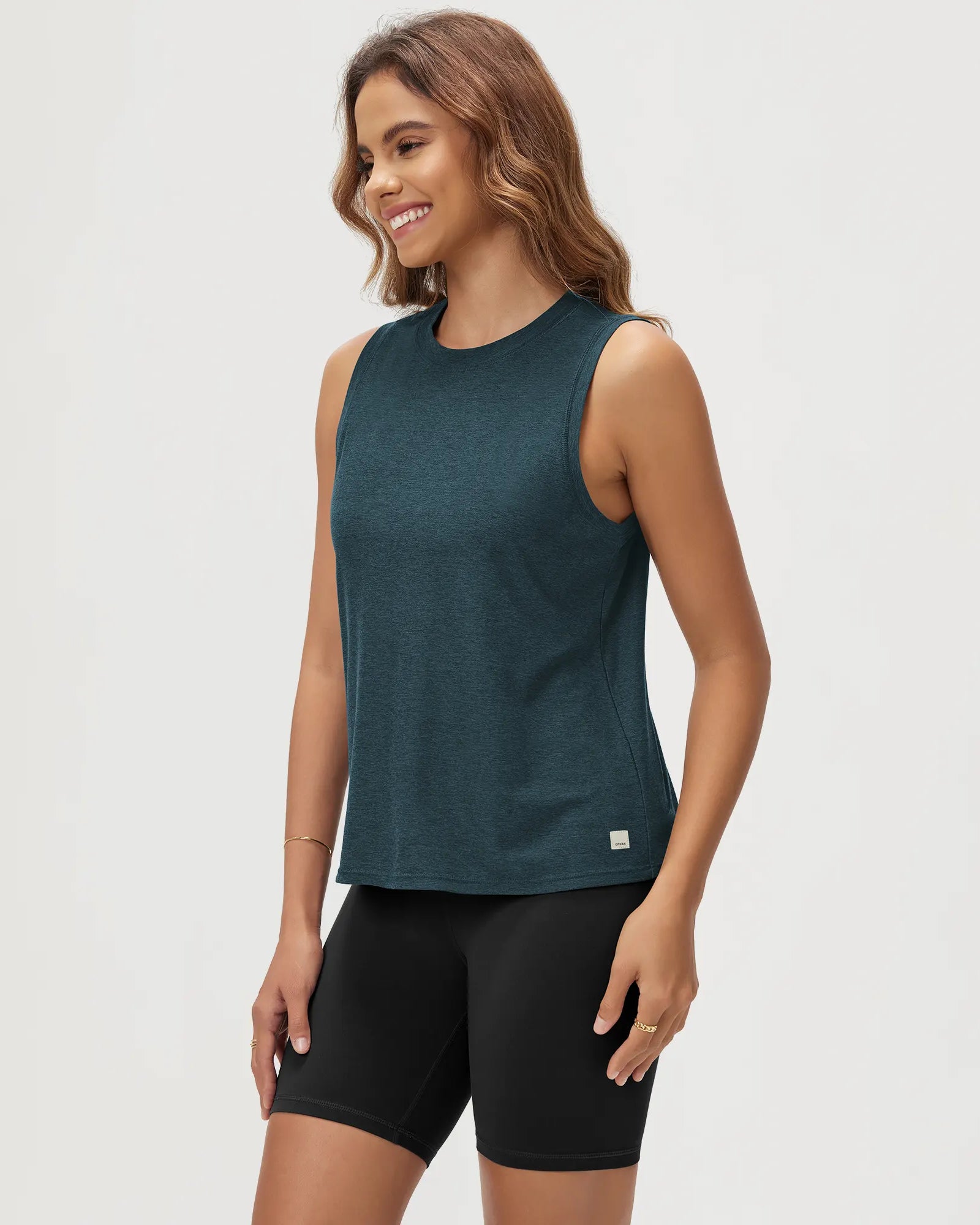ODODOS Stratum Women's Performance Tank in teal with soft fabric and athletic fit.