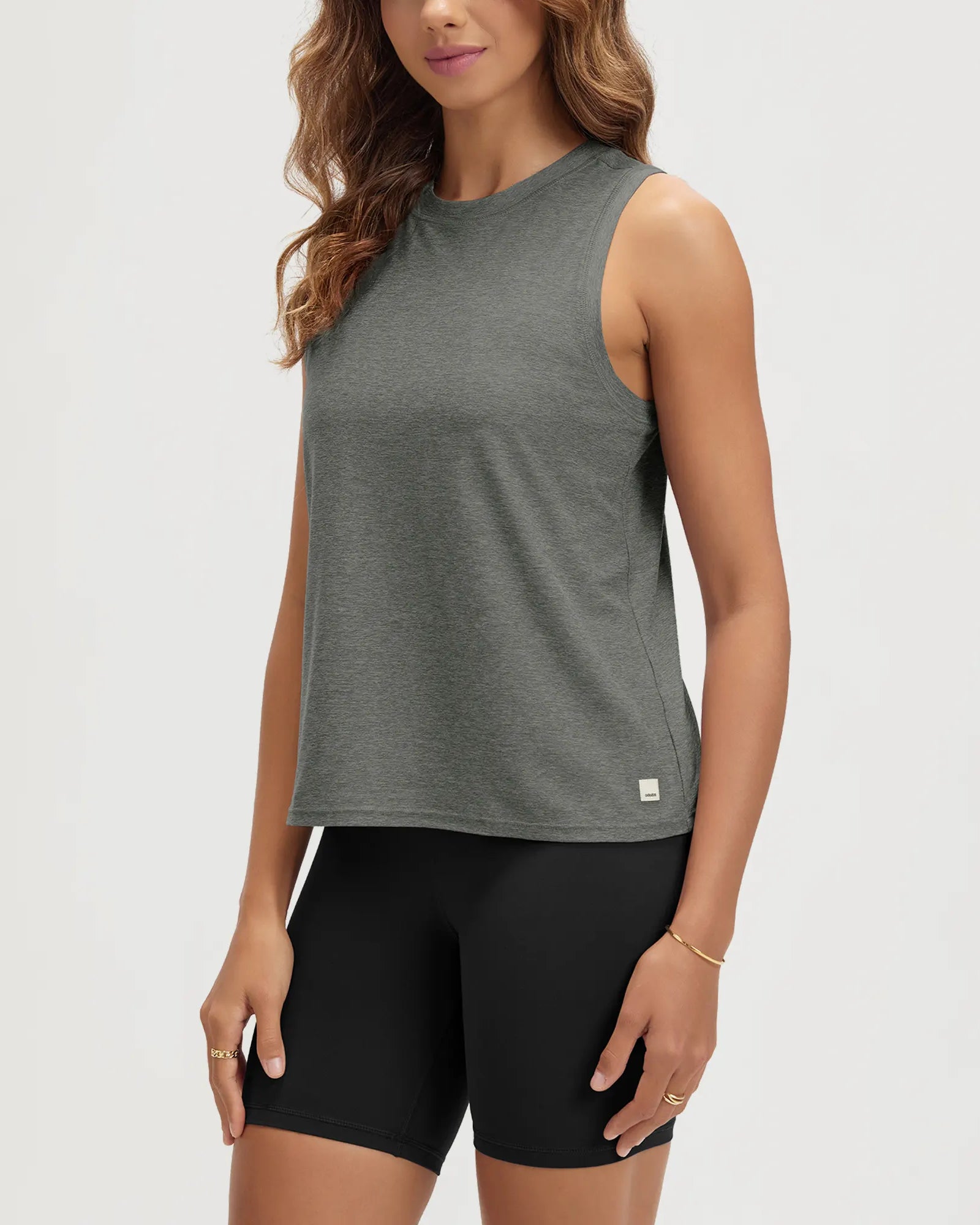 ODODOS Stratum Women's Performance Tank in dark grey, soft fabric, ideal for workout wear.