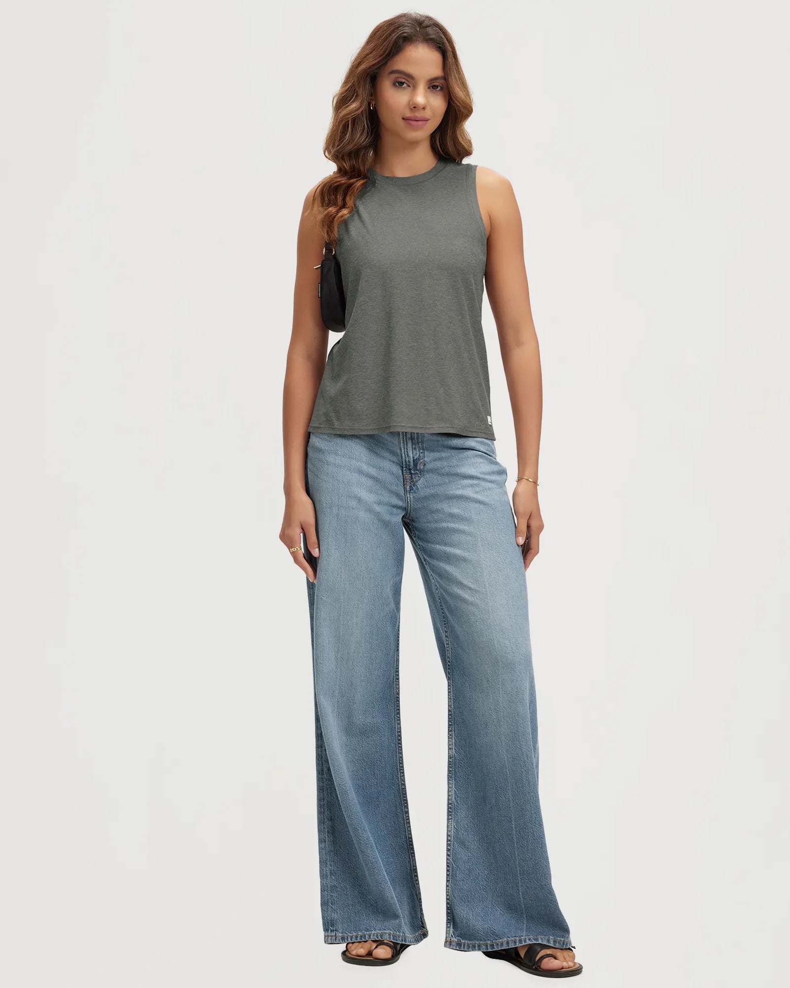 ODODOS Stratum Women's Performance Tank in soft fabric, styled with wide-leg jeans.