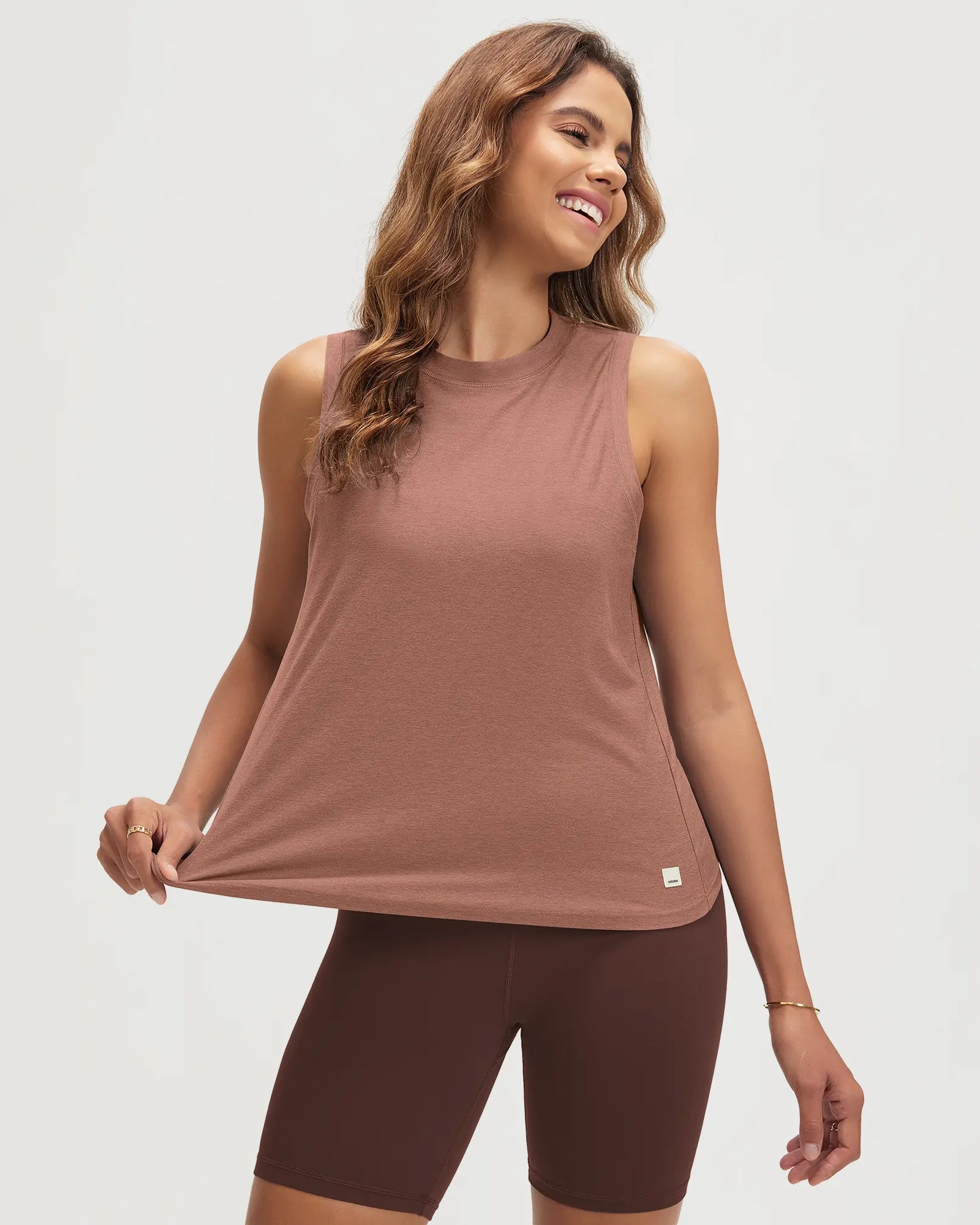 ODODOS Stratum women's performance tank with breathable soft fabric and loose fit.