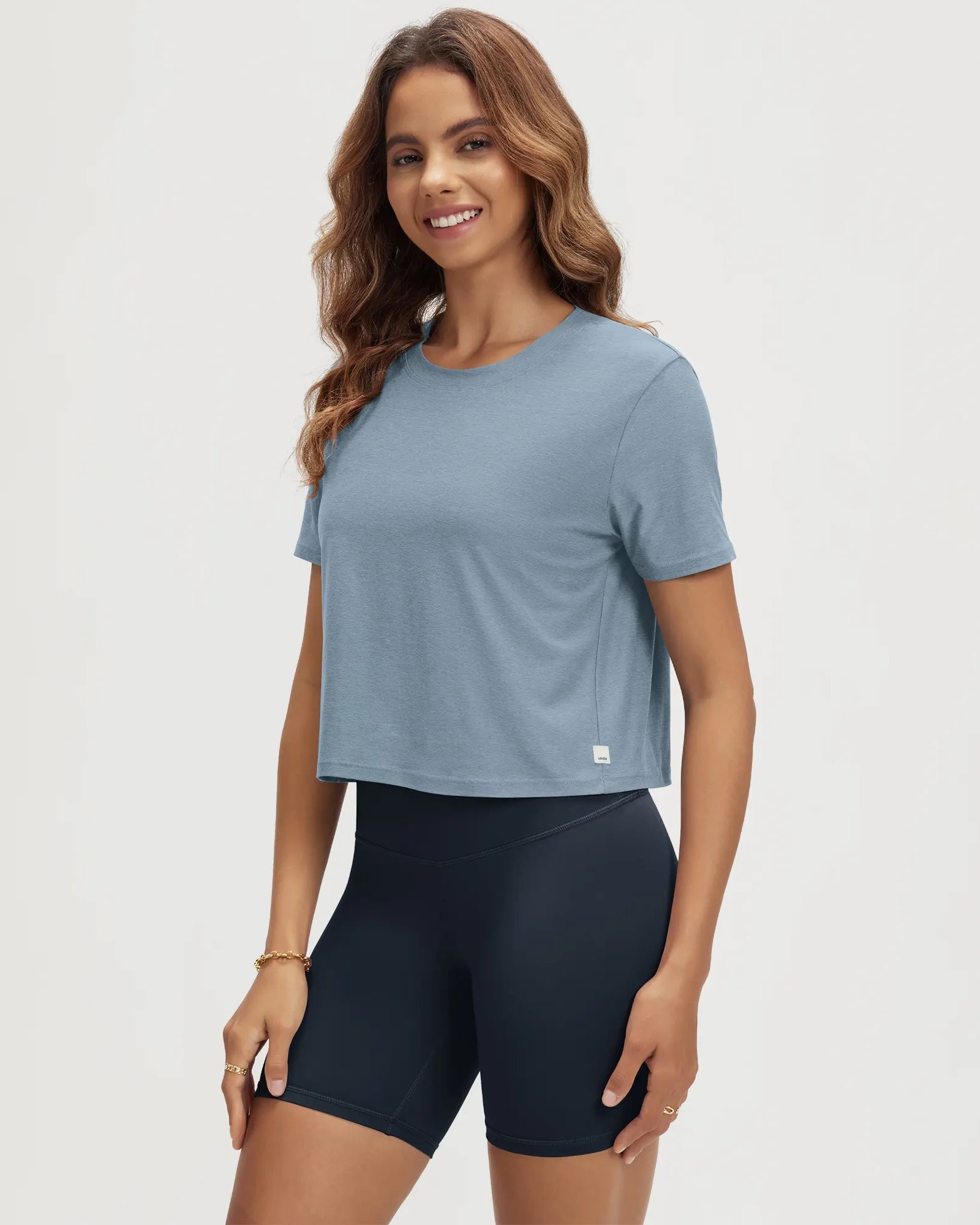 ODODOS Stratum Women's Performance Cropped Tee in soft fabric, perfect for workout wear.