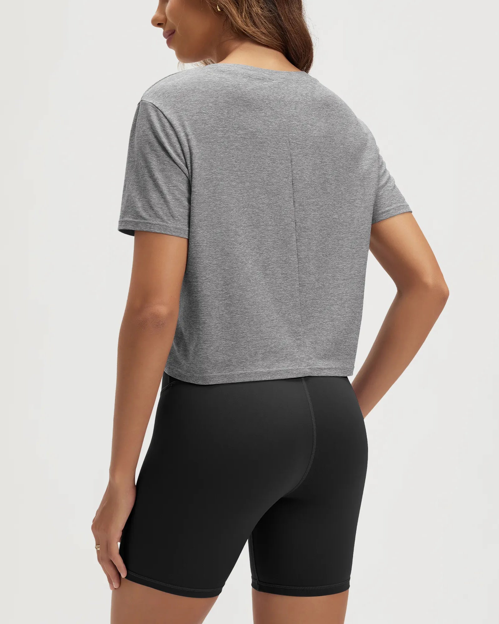 ODODOS Stratum Women's Performance Cropped Tee with soft fabric, paired with fitted athletic shorts.