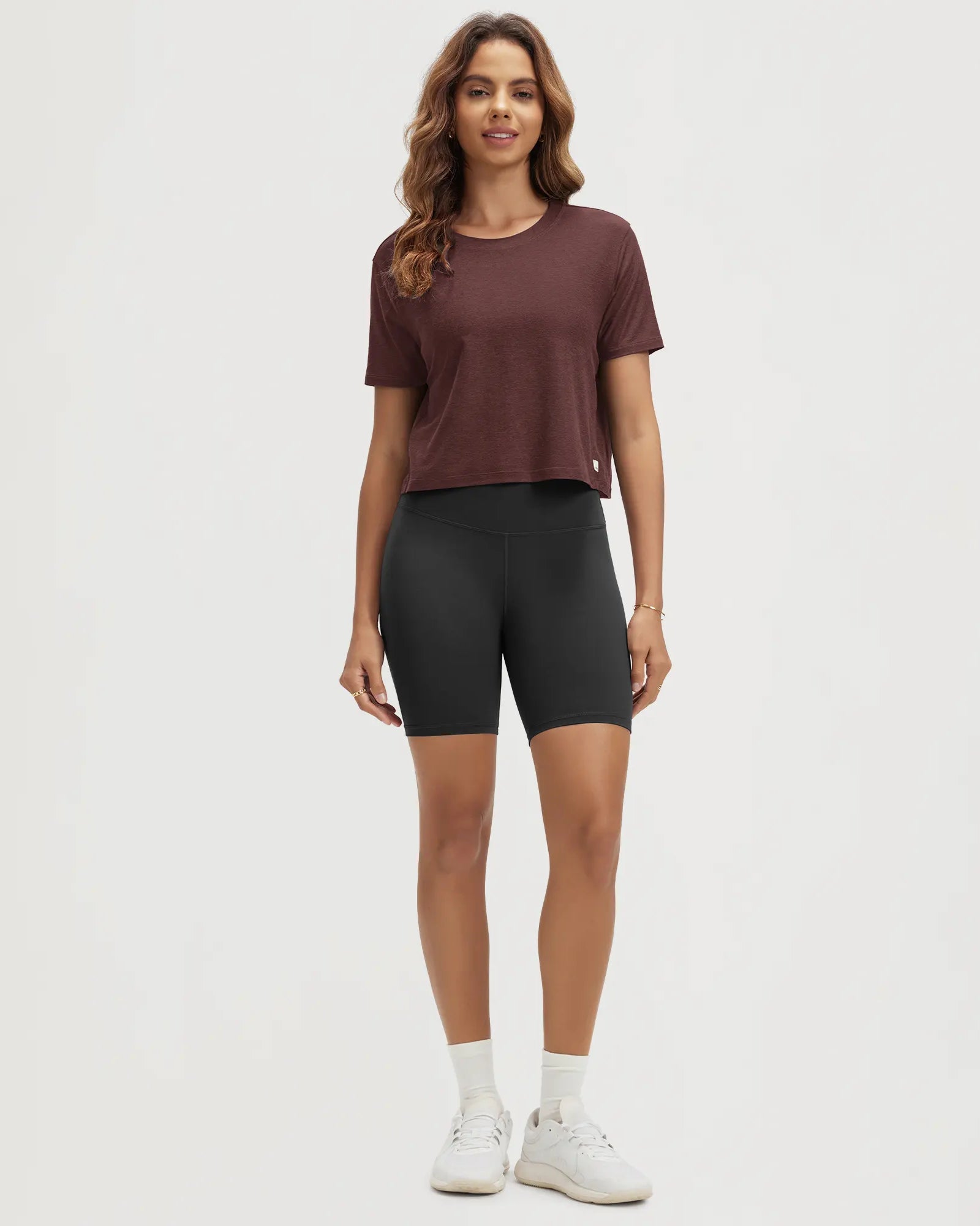 ODODOS Stratum Women's Performance Cropped Tee in soft fabric with workout shorts.