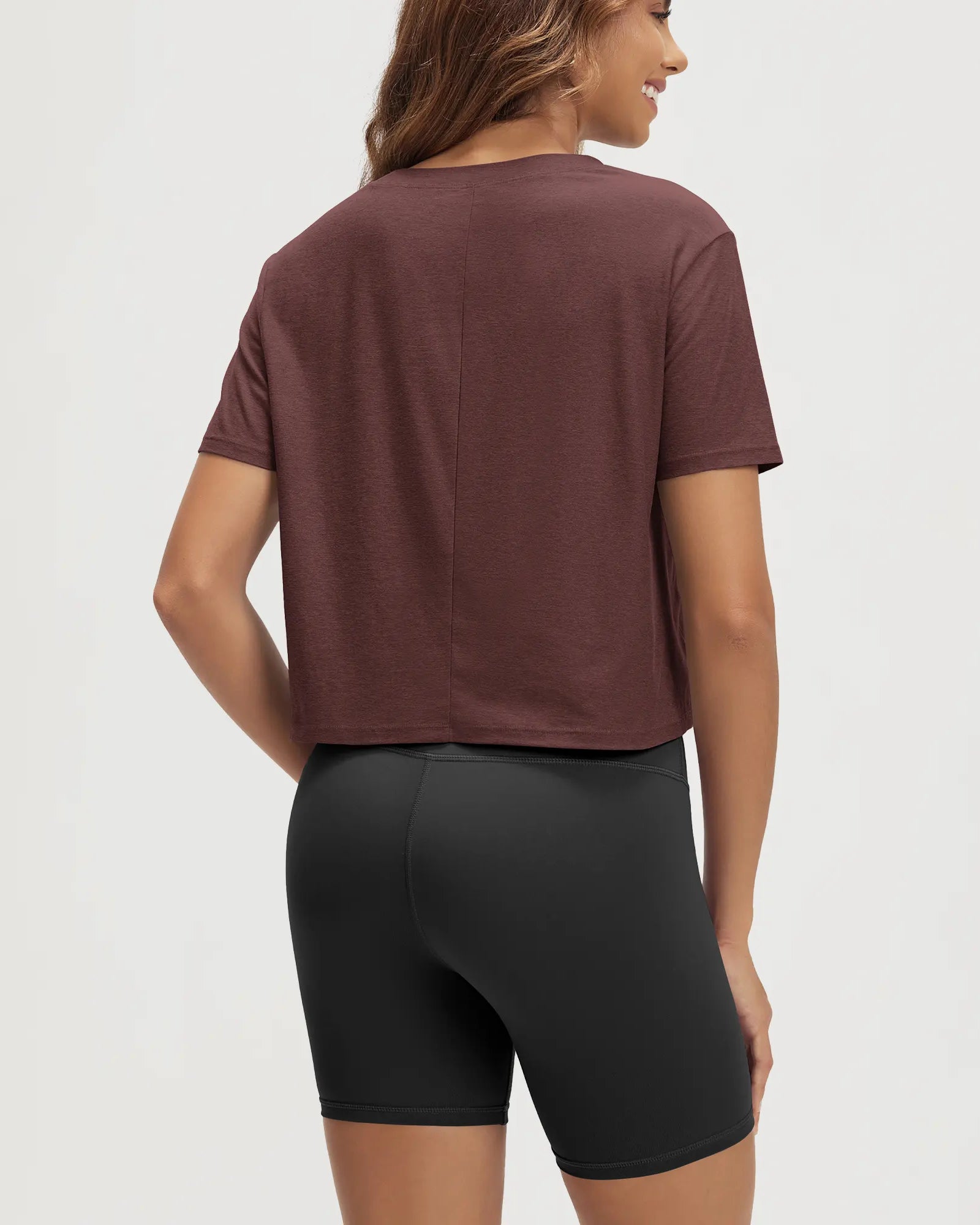 ODODOS Stratum Women's Performance Cropped Tee with quick dry shorts, showing athletic fit and soft fabric.