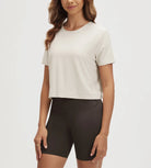 ODODOS Stratum Women's Performance Cropped Tee in soft fabric paired with workout shorts