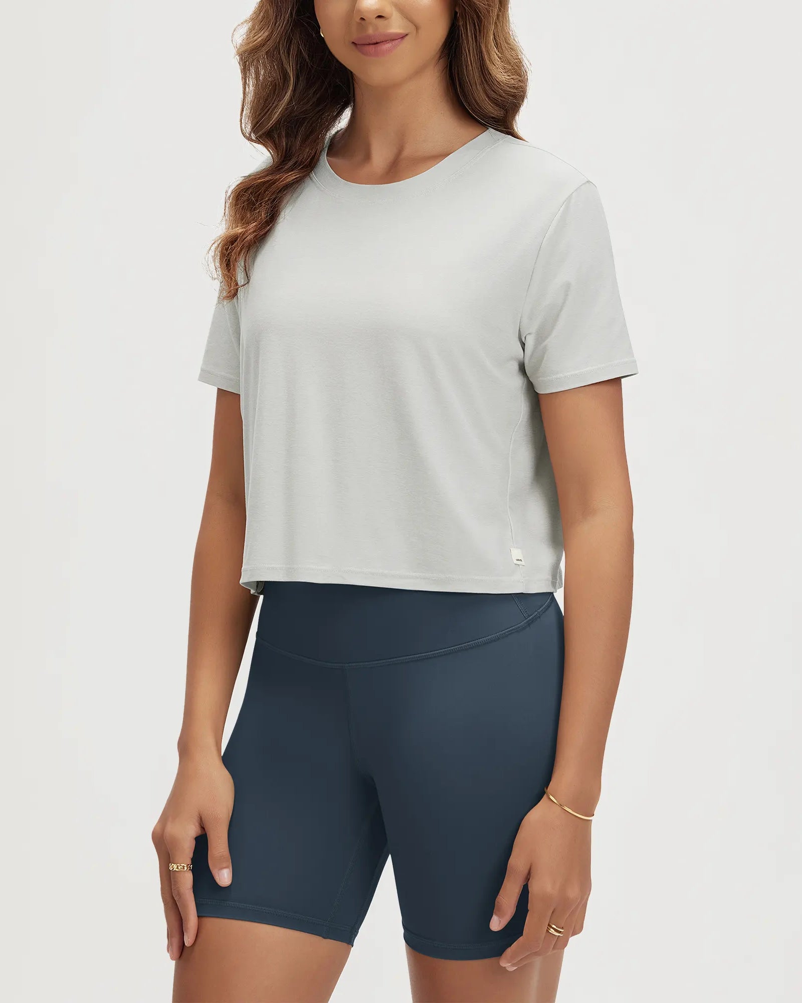 ODODOS Stratum Women's Performance Cropped Tee paired with soft fabric athletic shorts.