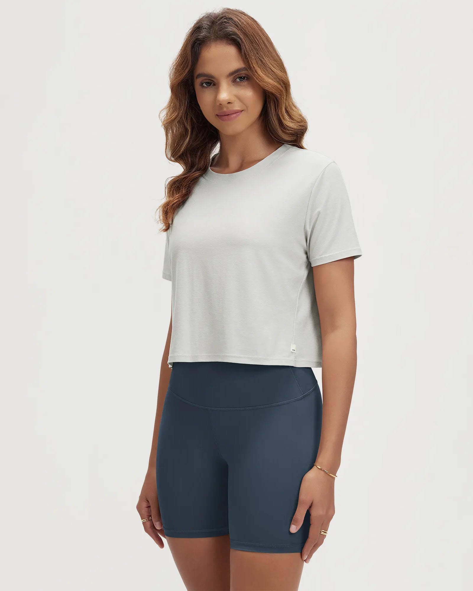 ODODOS Stratum Women's performance cropped tee with soft fabric, perfect for workout wear.