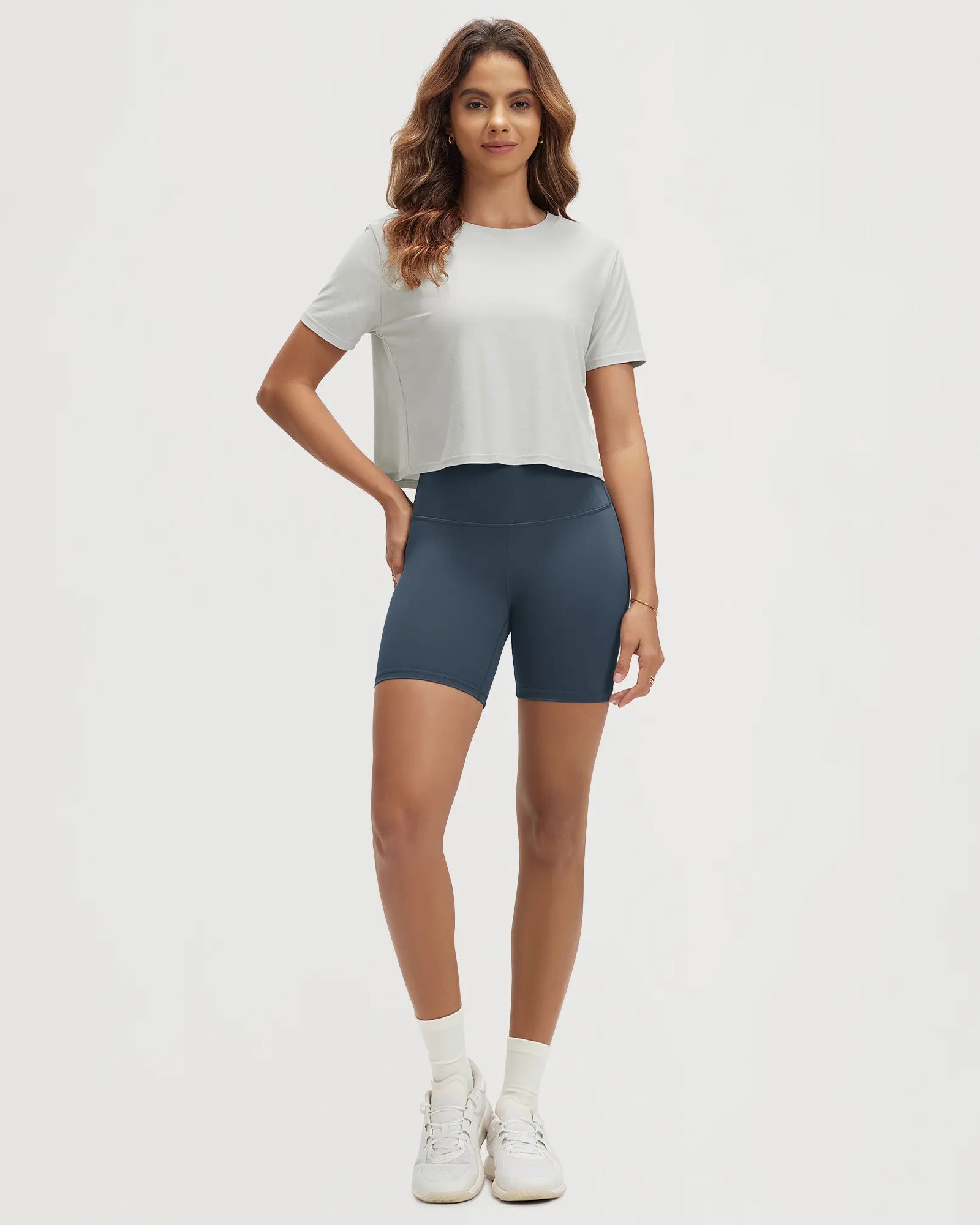 ODODOS Stratum women's performance cropped tee paired with high-waisted shorts.