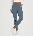 25" Fleece Lined Leggings with Pockets showcased in blue, featuring a unique design and comfortable fit.