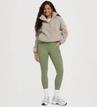 25" Fleece Lined Leggings with Pockets in olive green, styled with a cozy fleece jacket and sneakers.