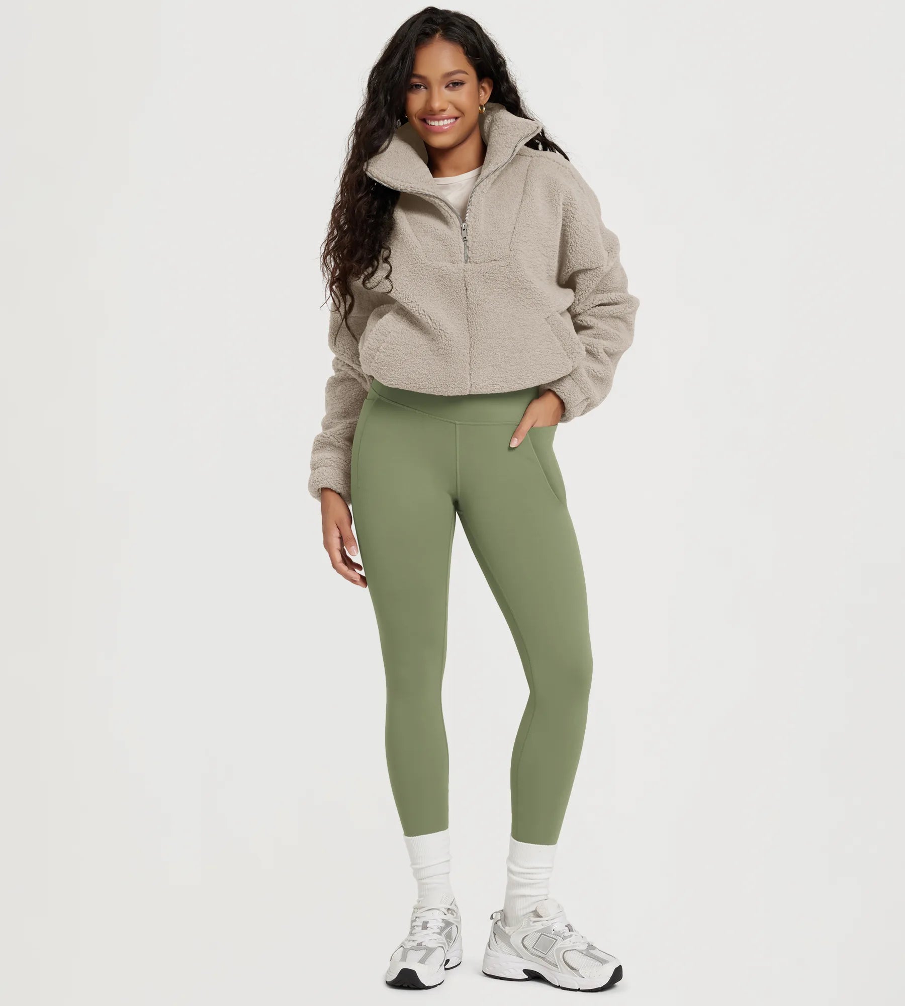 25" Fleece Lined Leggings with Pockets in olive green, styled with a cozy fleece jacket and sneakers.