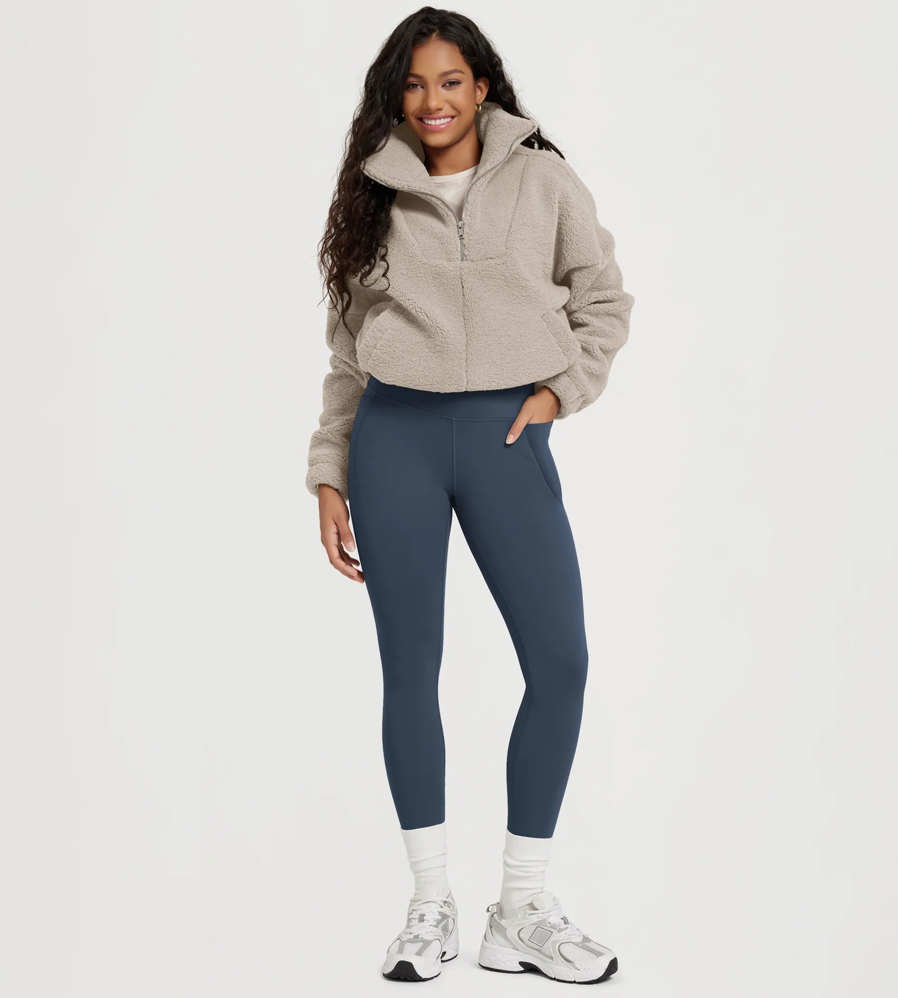 25" Fleece Lined Leggings with Pockets worn by a model, featuring a stylish and comfortable look.