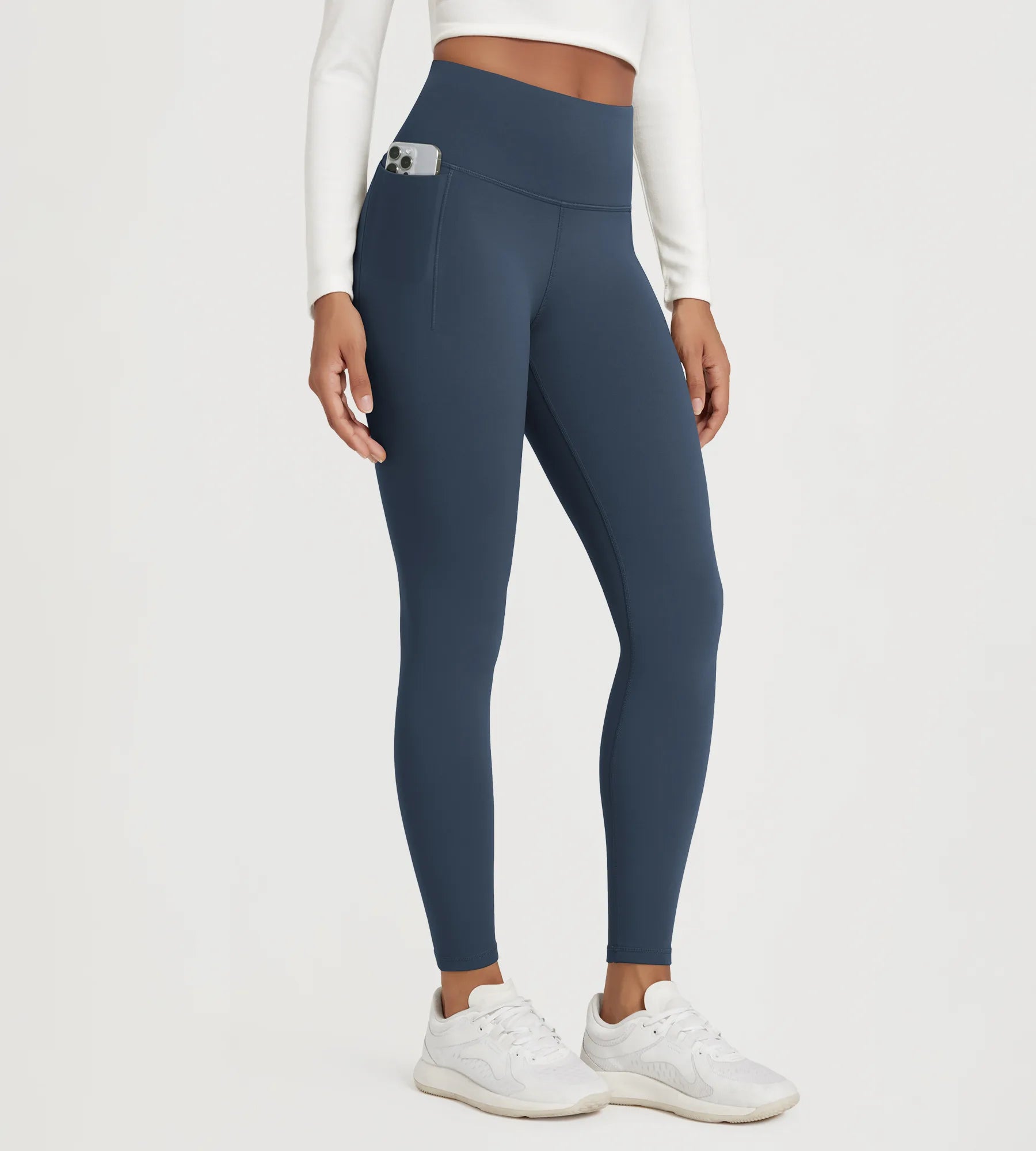 25" Fleece Lined Leggings with Pockets in navy, featuring a high waistband and side pocket for convenience.