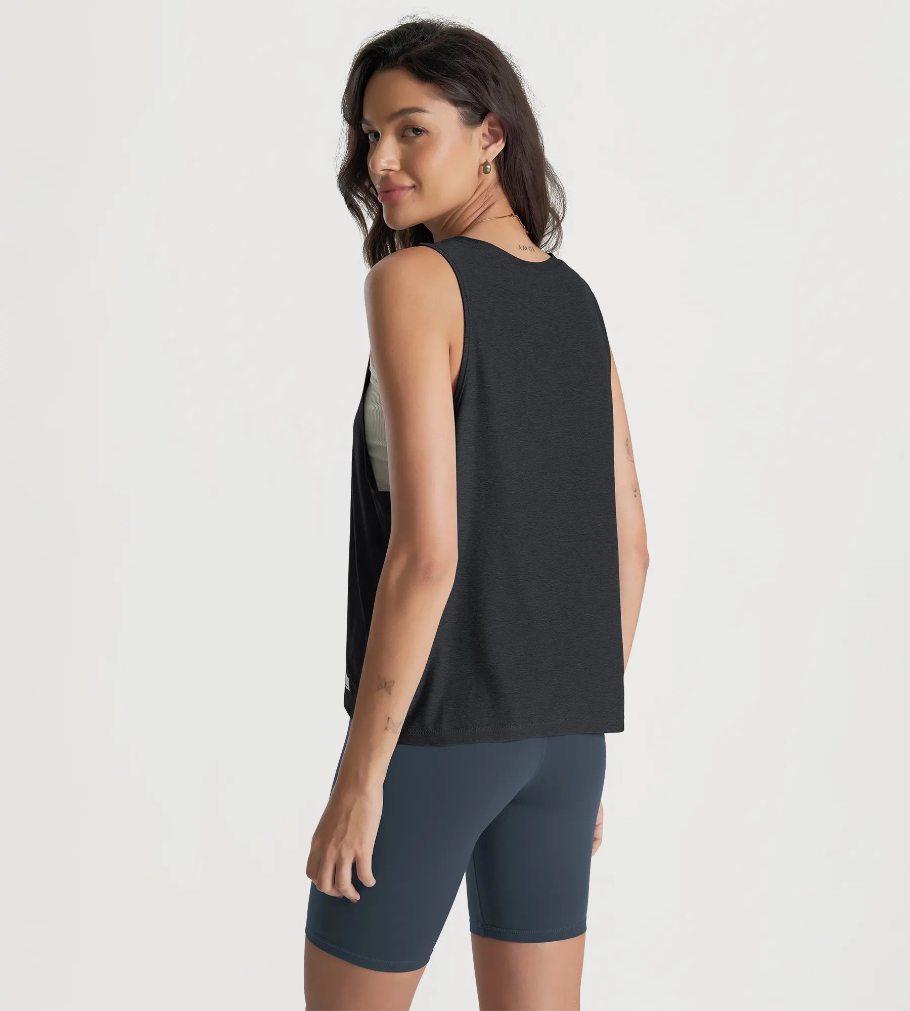 ODODOS Stratum loose tank tops showcasing soft fabric and athletic fit for workout wear.
