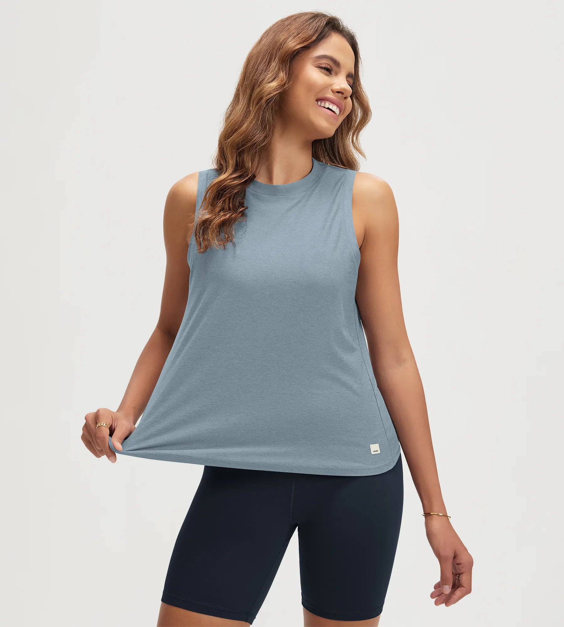 ODODOS Stratum Women's Performance Tank in blue, soft fabric, breathable design.