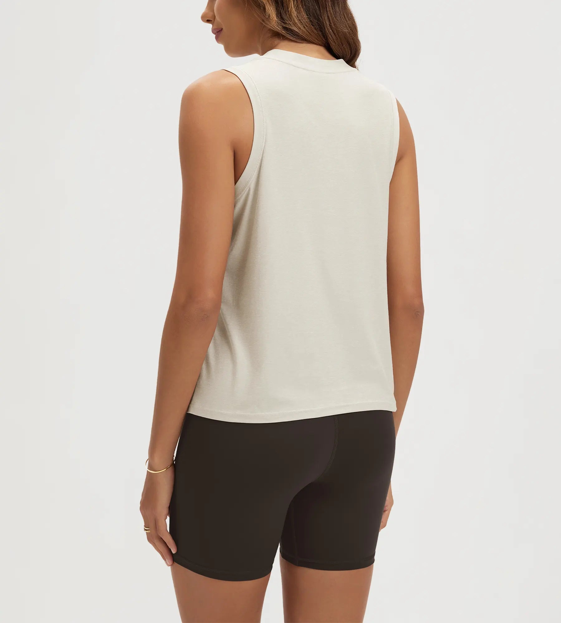 ODODOS Stratum women's performance tank with athletic fit and soft fabric, paired with shorts.
