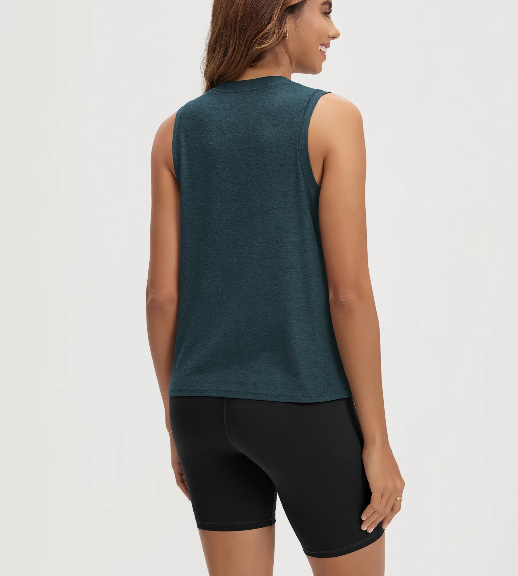 ODODOS Stratum women's performance tank in soft fabric, paired with black shorts.