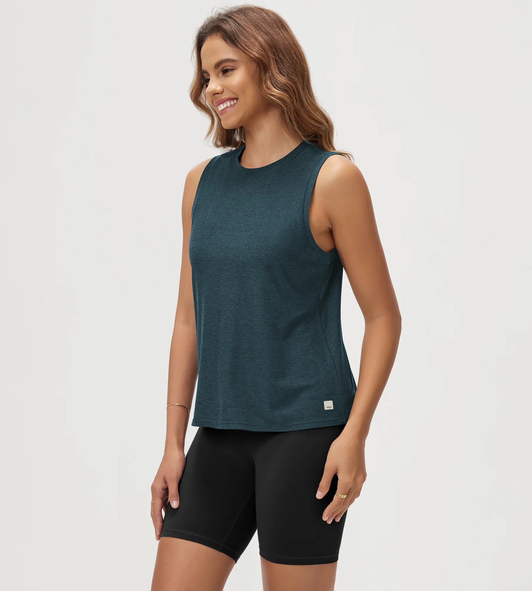 ODODOS Stratum Women's Performance Tank in teal with soft fabric and athletic fit.